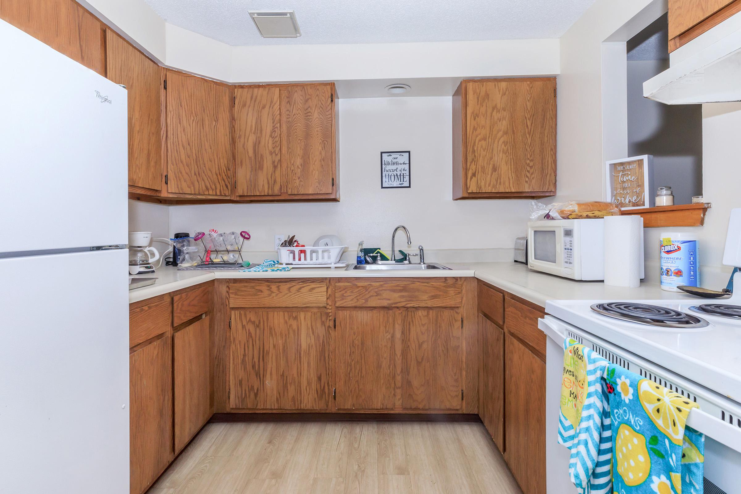 a kitchen with a sink and a refrigerator