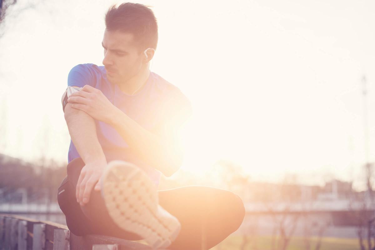 Athlete touching armband with mobile phone iStock_000061546064_Large.jpg