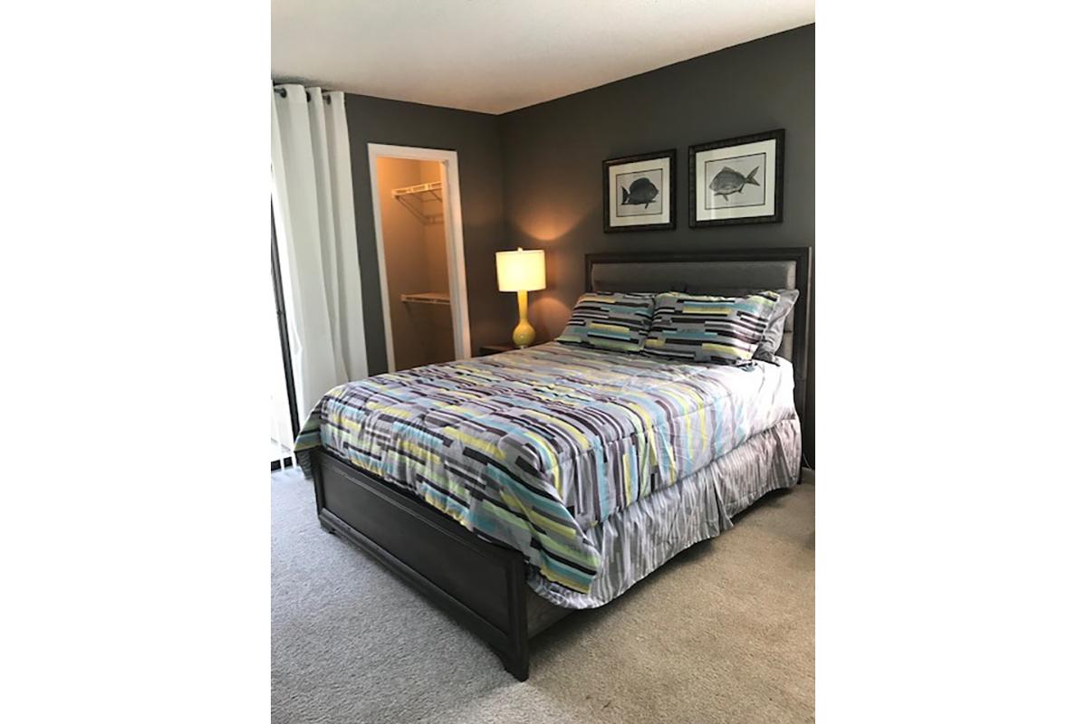 a bedroom with a bed in a room