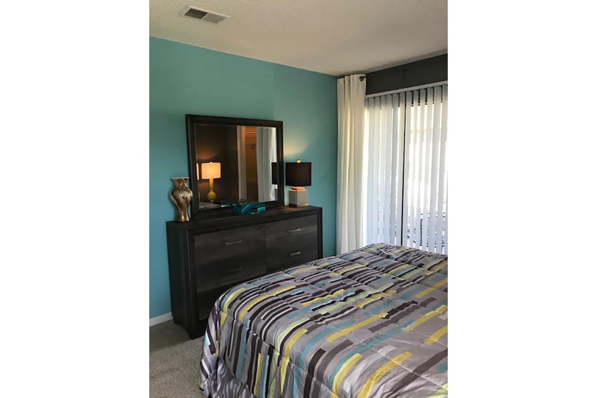 a bedroom with a bed in a room