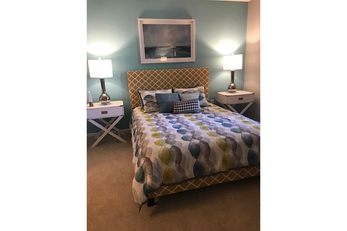 a bedroom with a bed in a room