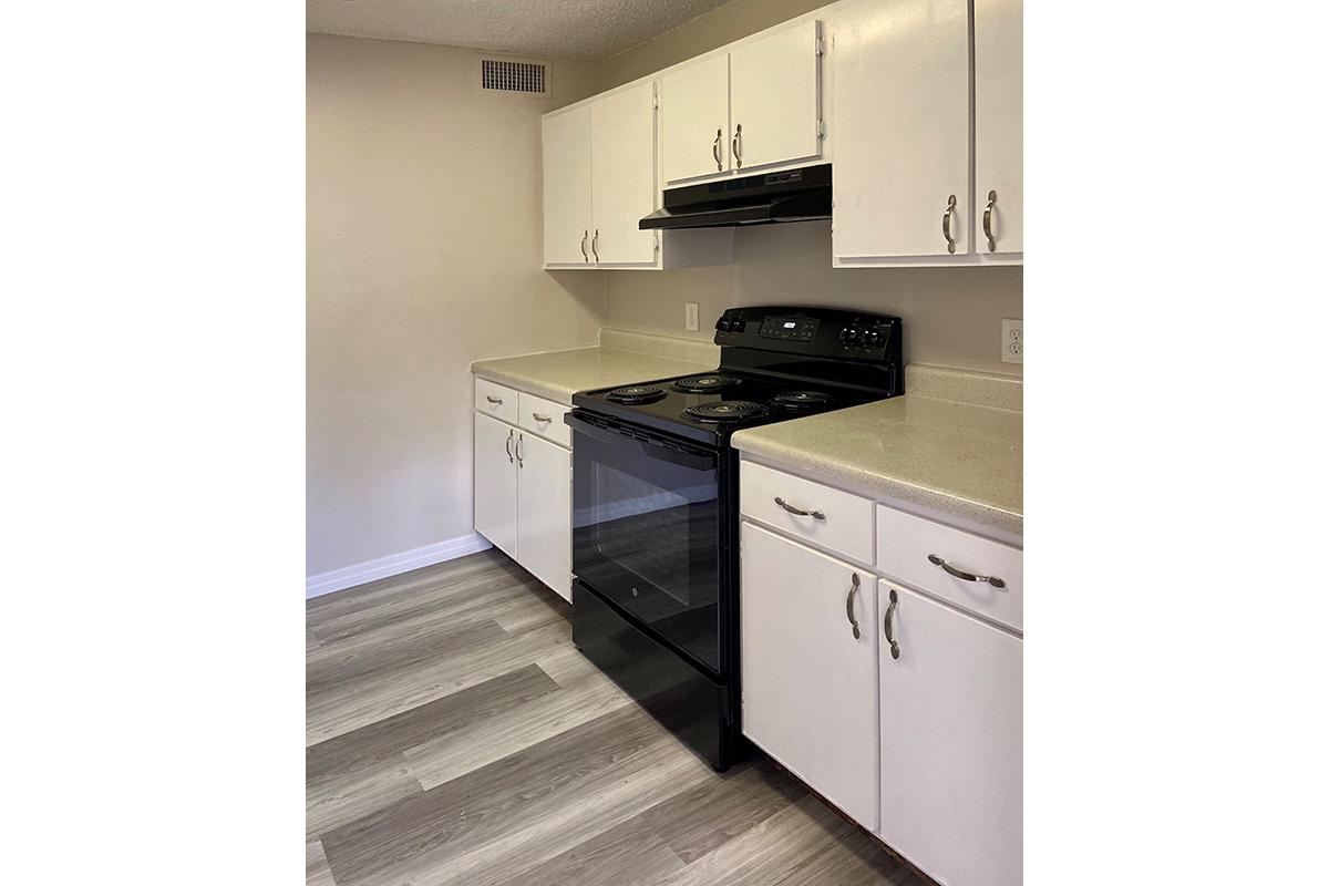 a kitchen with a stove and a refrigerator