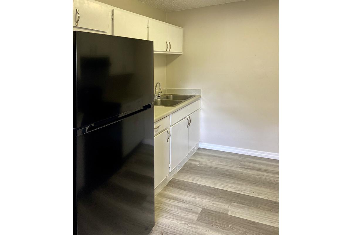 a stainless steel refrigerator in a kitchen