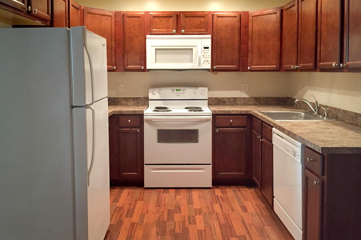 a kitchen with a stove top oven sitting inside of a refrigerator