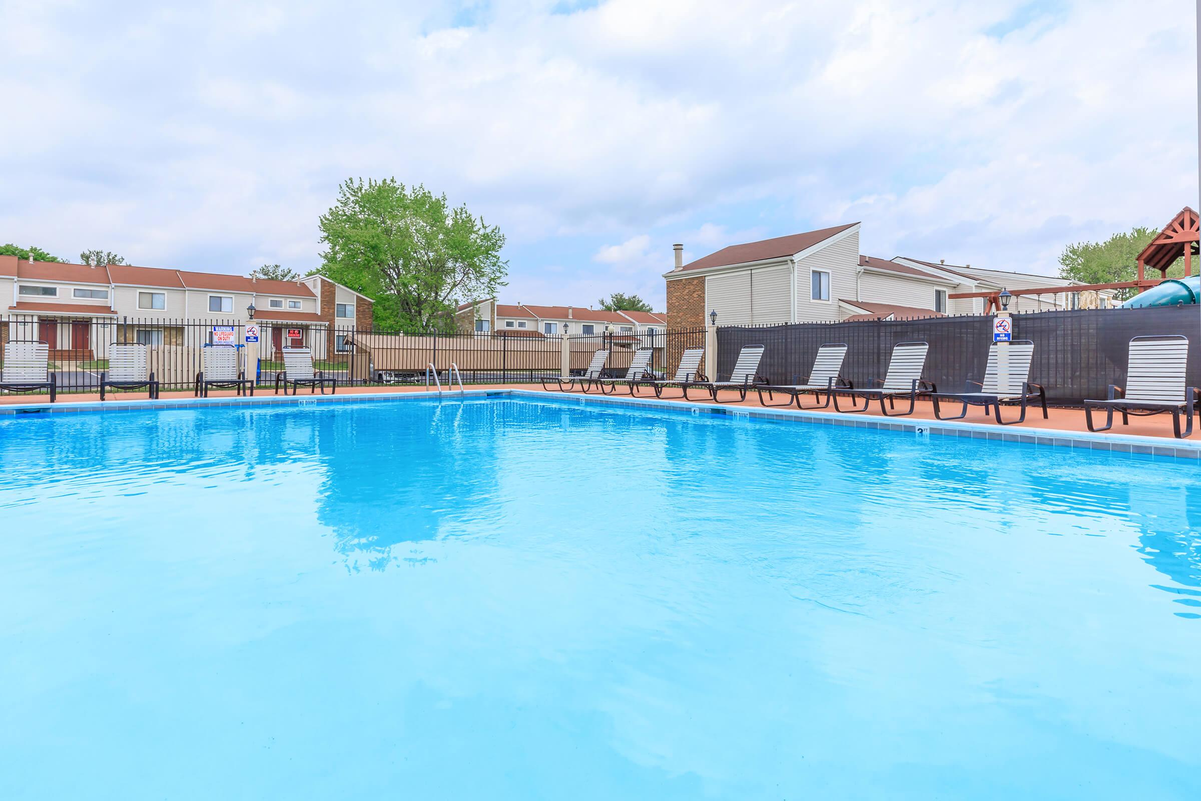 a pool next to a body of water