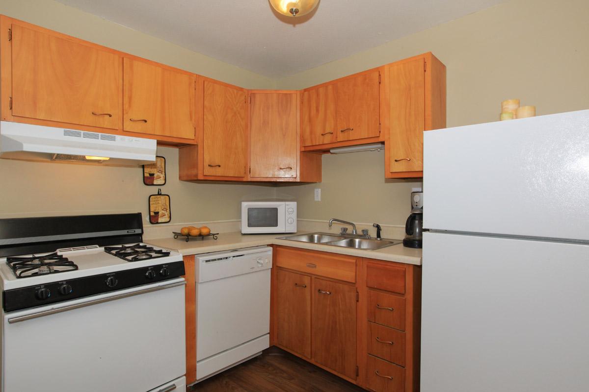 a kitchen with a stove top oven sitting inside of a refrigerator