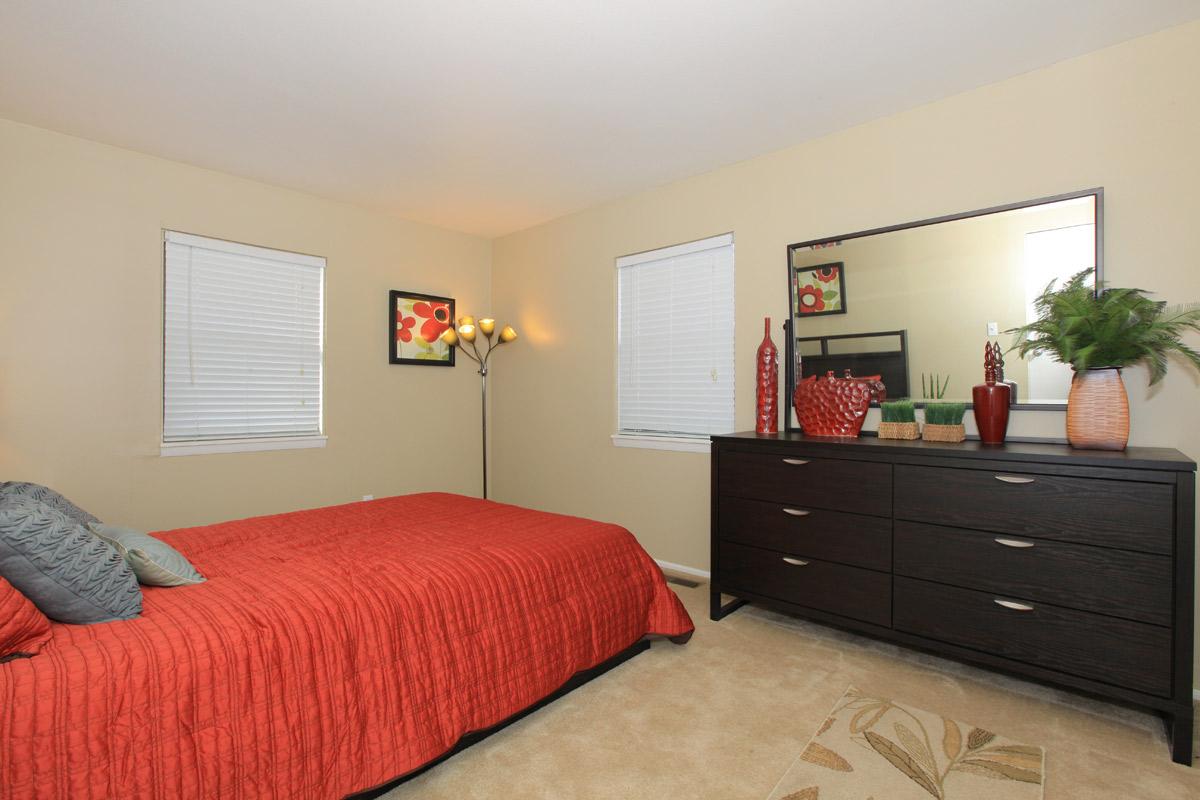 a bedroom with a large bed in a room