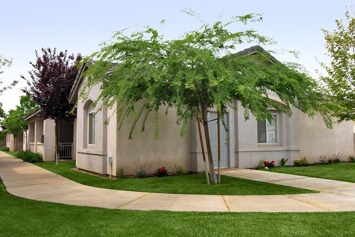 Liberty Park community building with green trees