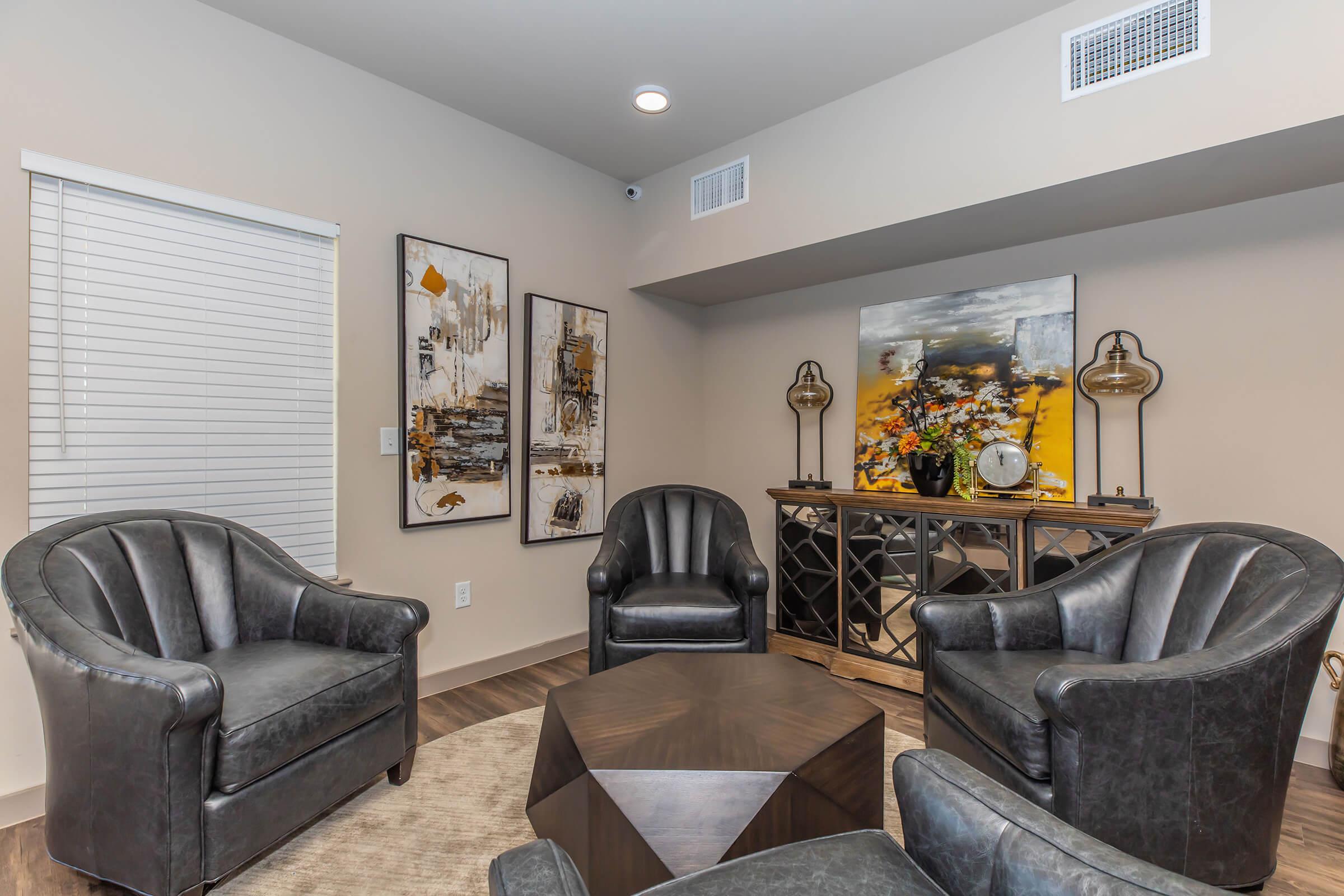 a living room filled with furniture and a fireplace