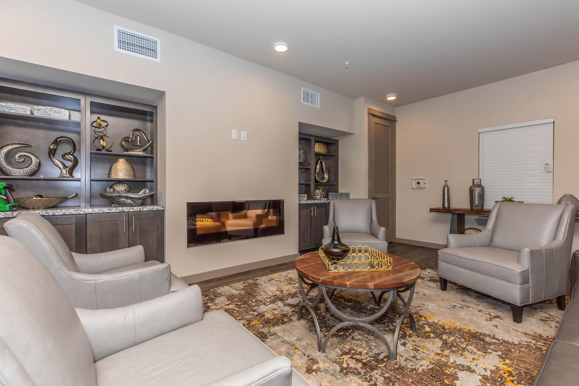 a living room filled with furniture and a flat screen tv