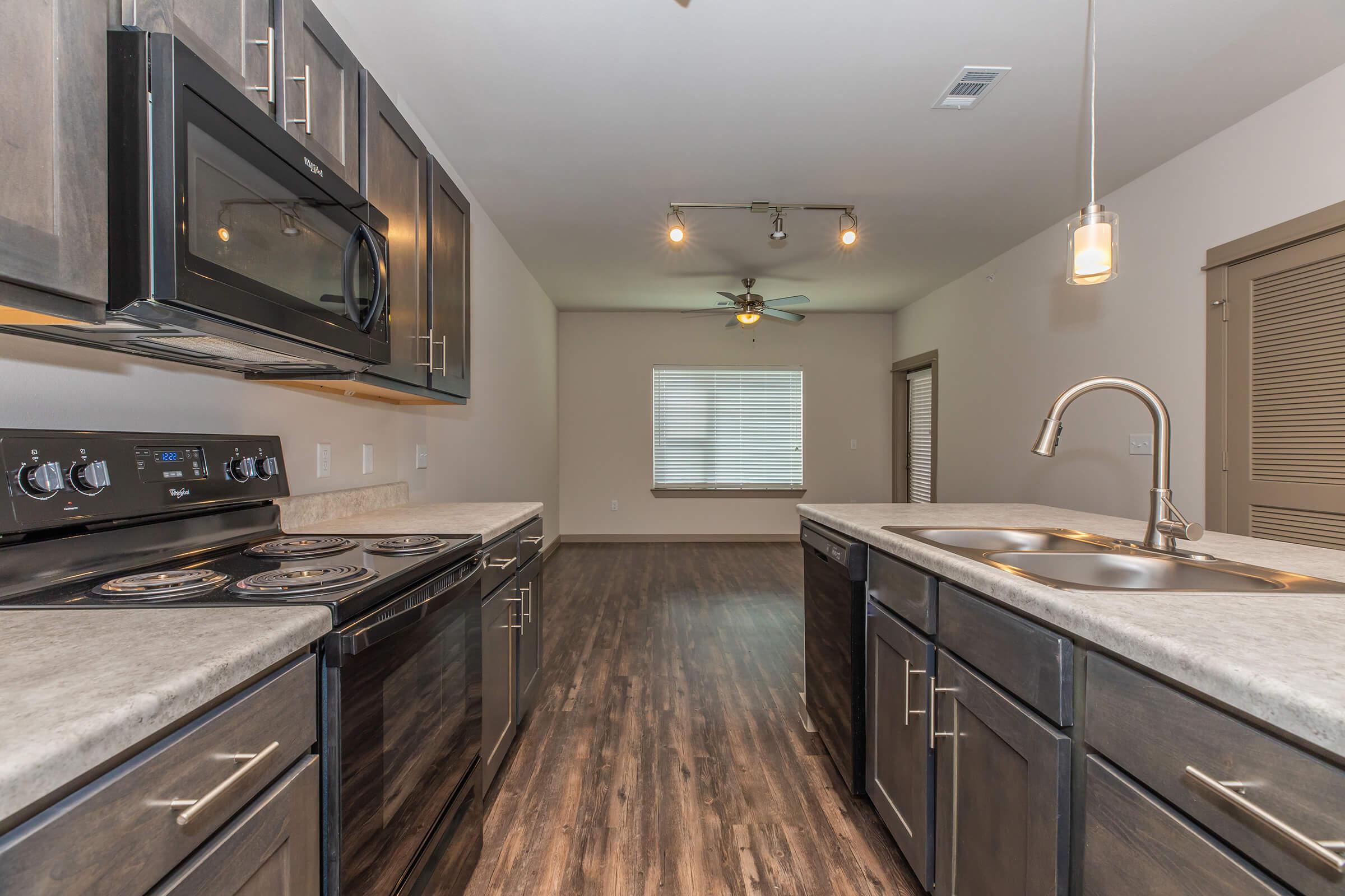 a large kitchen with stainless steel appliances