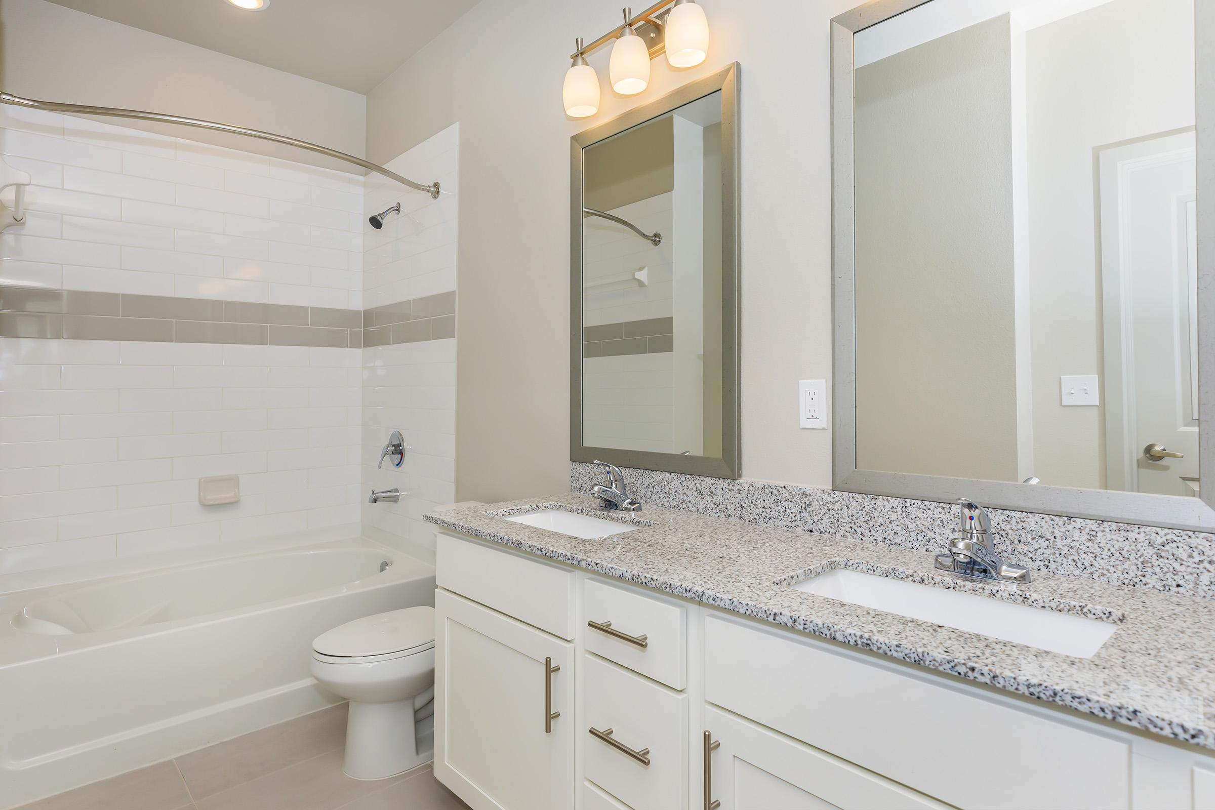 Sleek bathrooms at Ariza Gosling in Spring, Texas