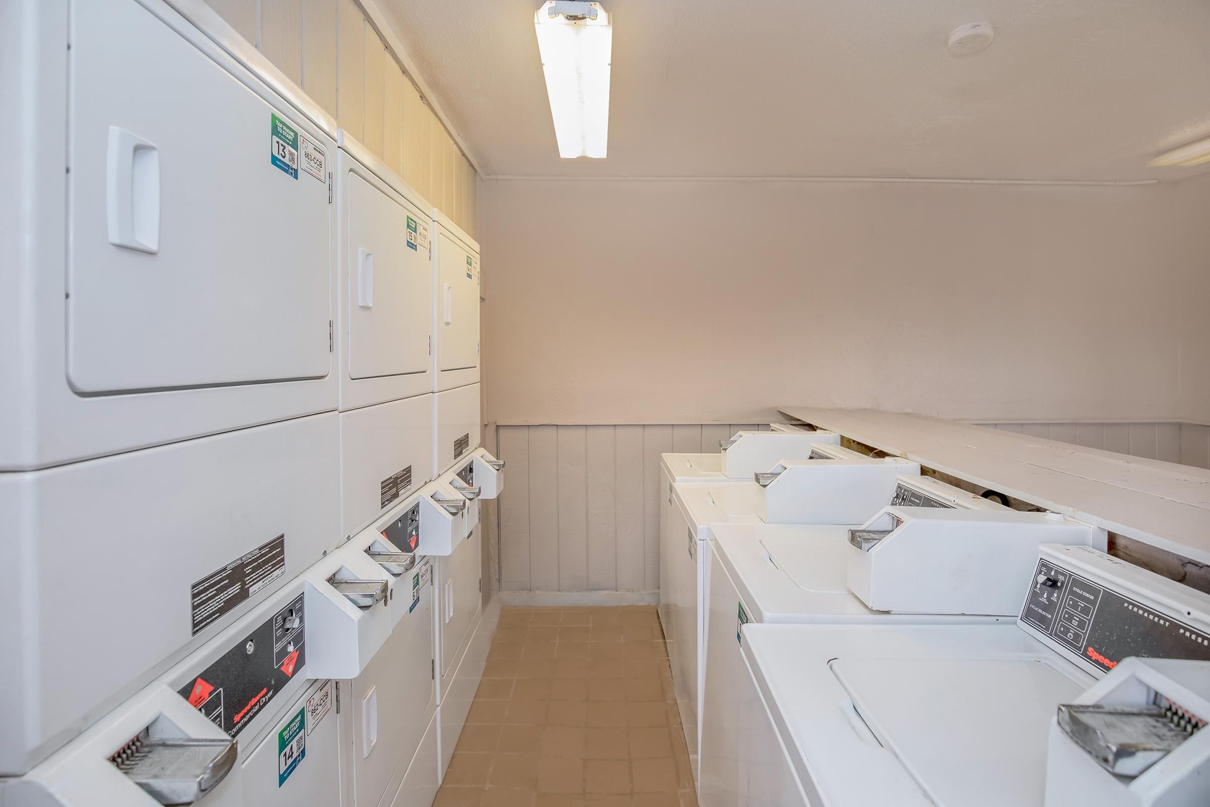 a kitchen with a sink and a refrigerator