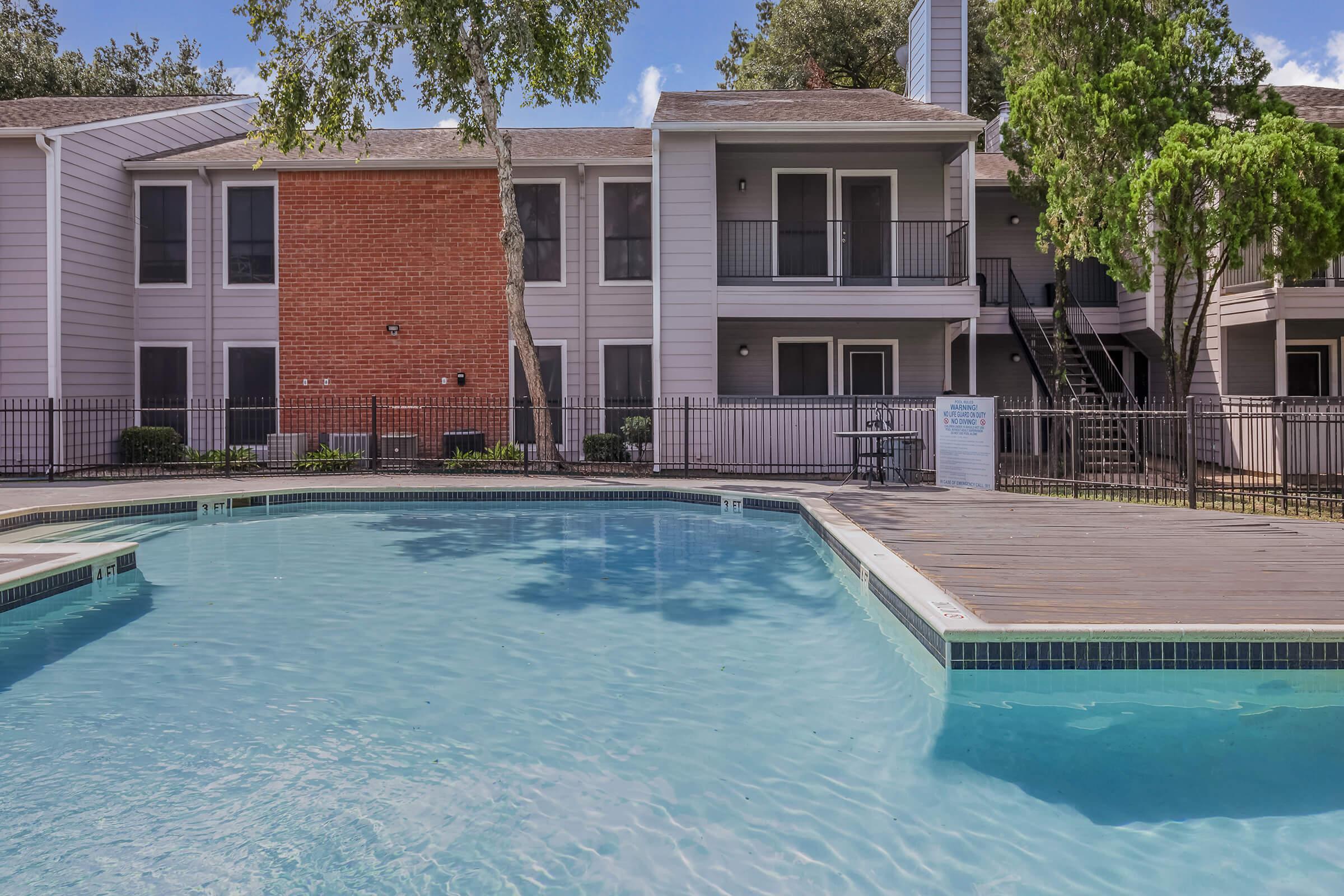 a house with a large pool of water