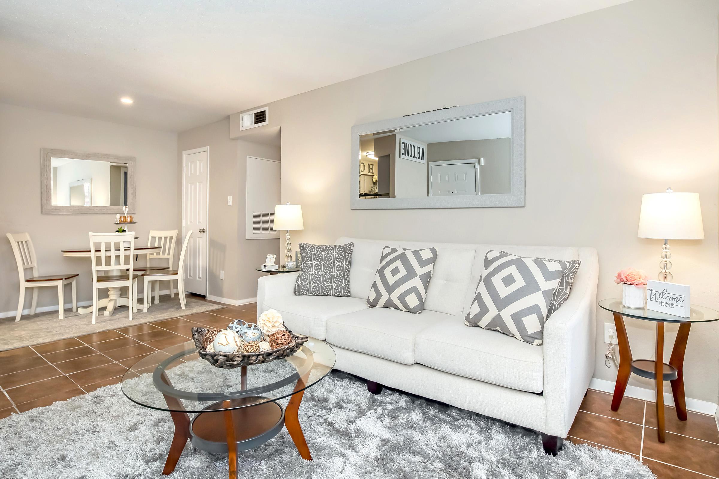 a living room filled with furniture and a fireplace