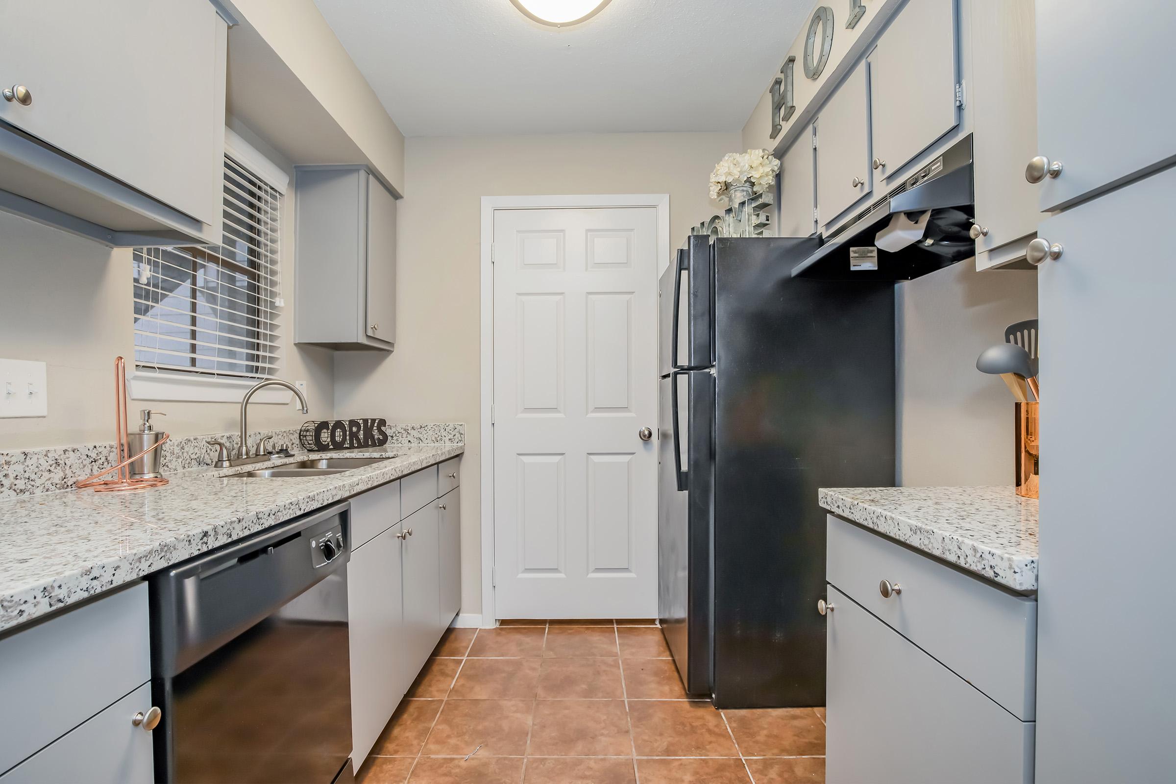 a large kitchen with stainless steel appliances