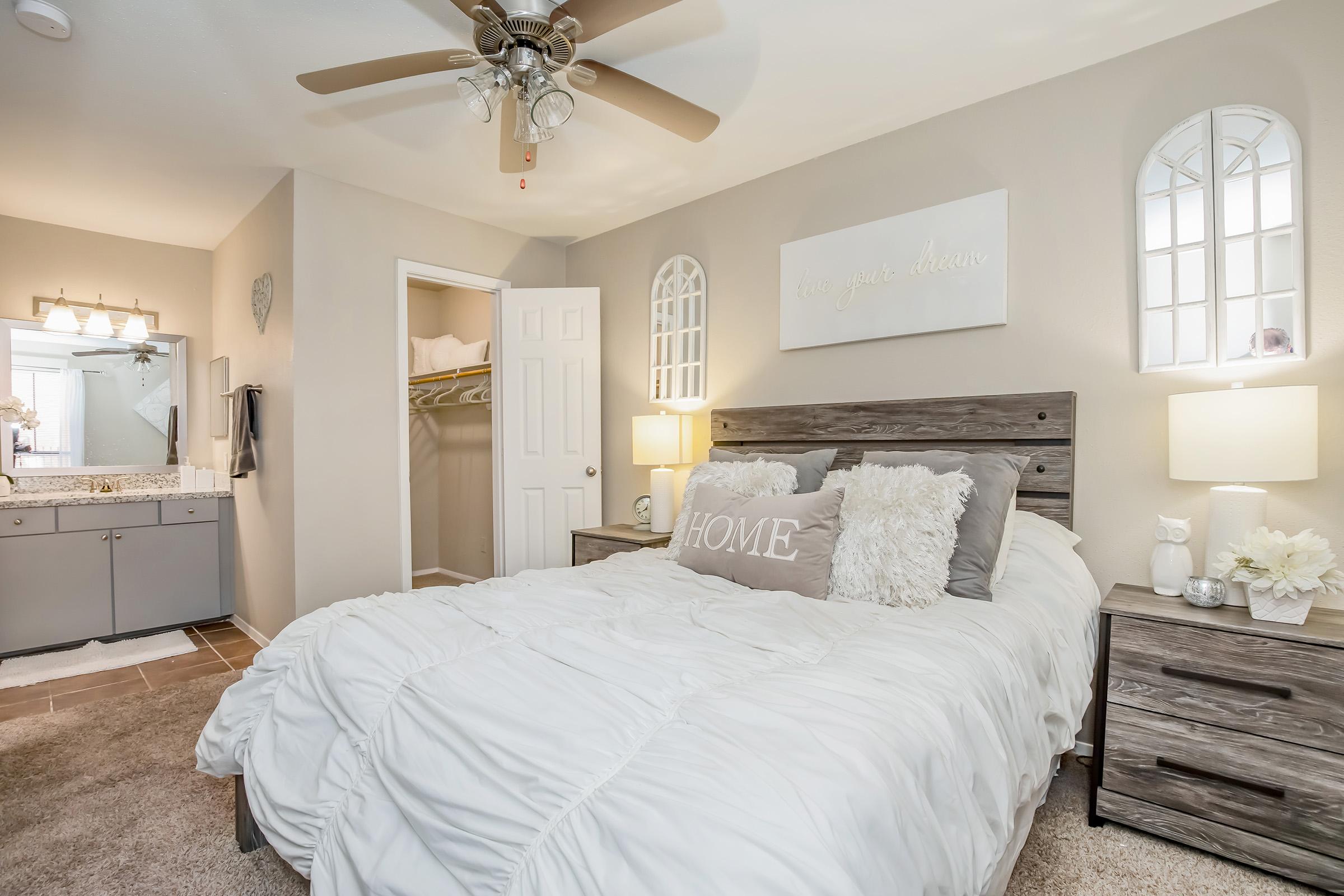 a bedroom with a large bed in a room