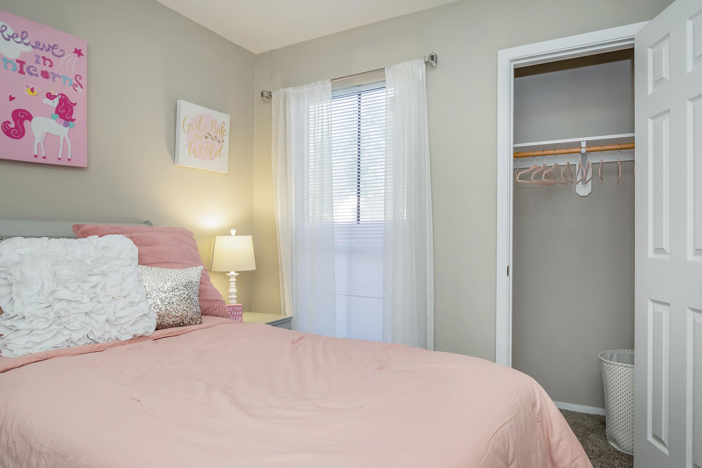 a bedroom with a bed in a hotel room