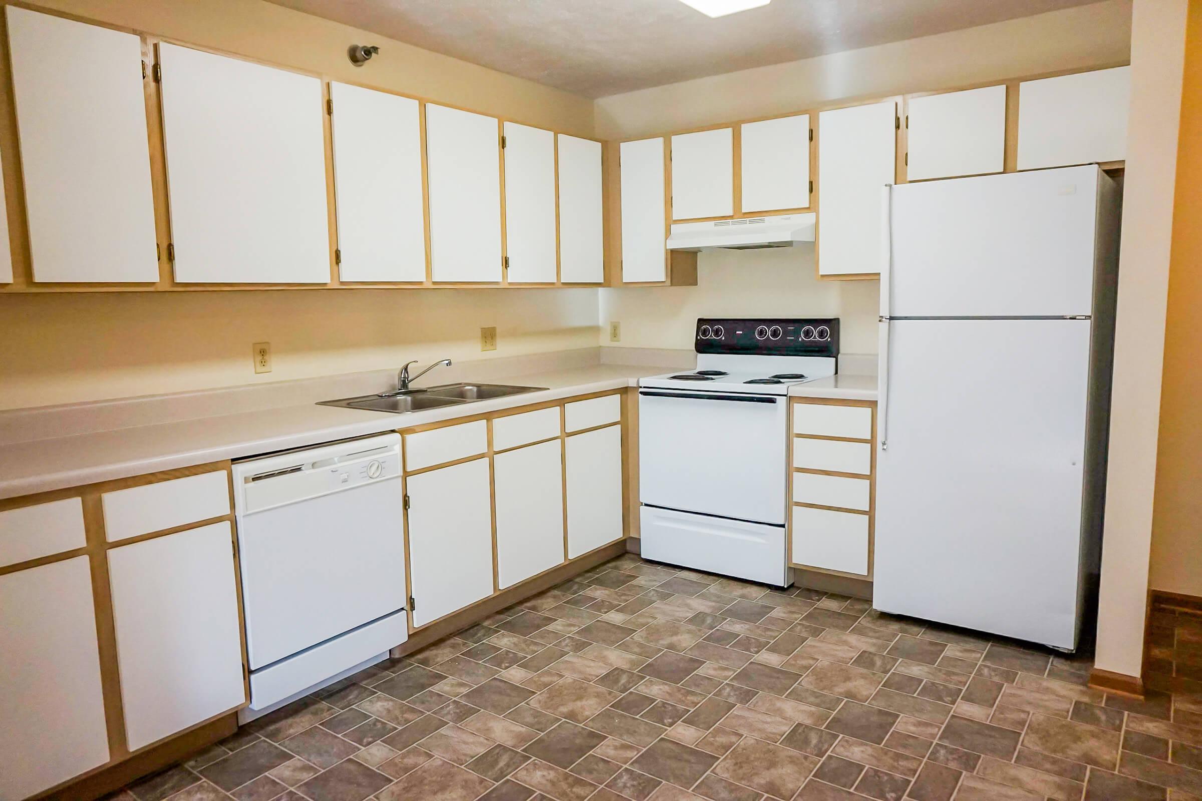 a kitchen with a sink and a window