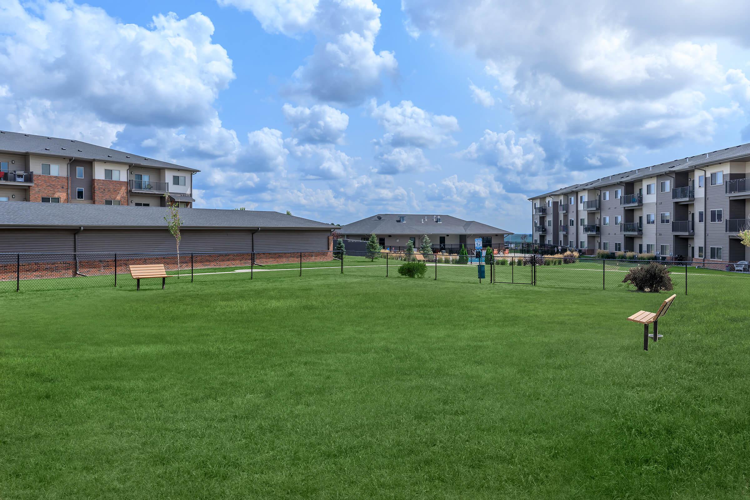 a building with a grassy field