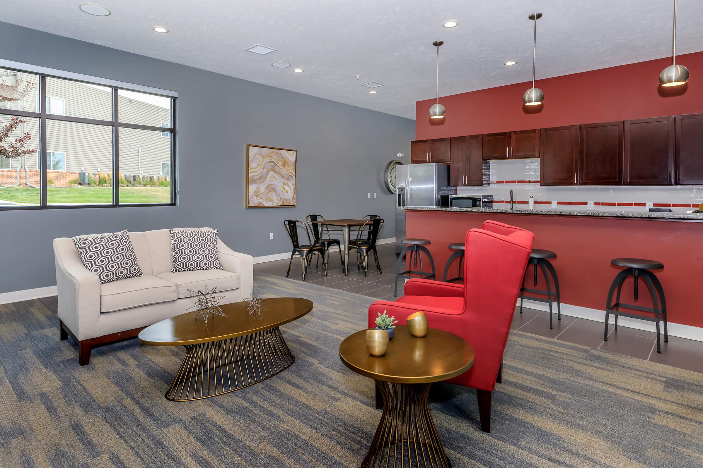 a living room filled with furniture and a table