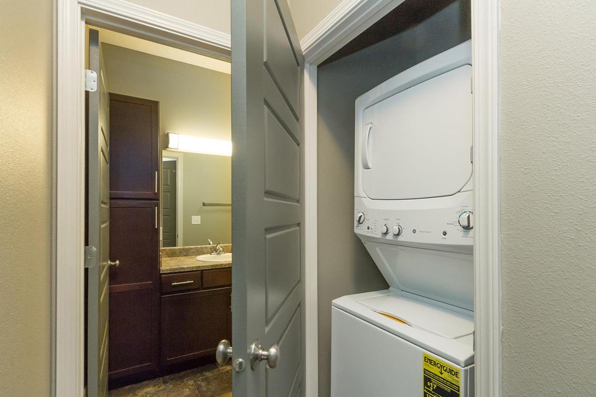 a white sink sitting next to a door