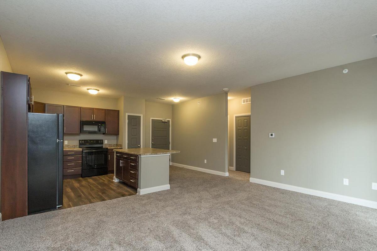 a large room filled with furniture and a flat screen tv