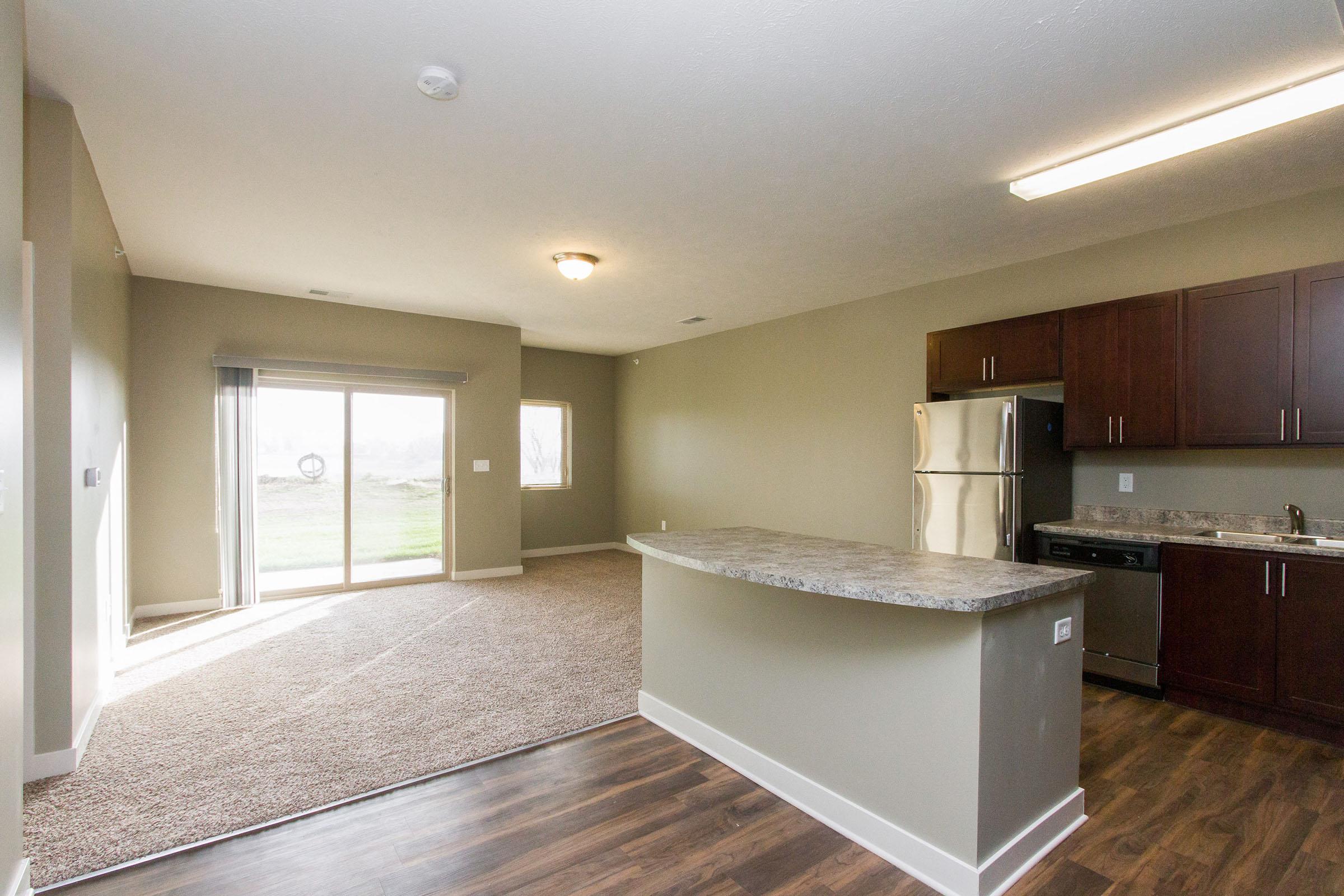 a large kitchen with stainless steel appliances