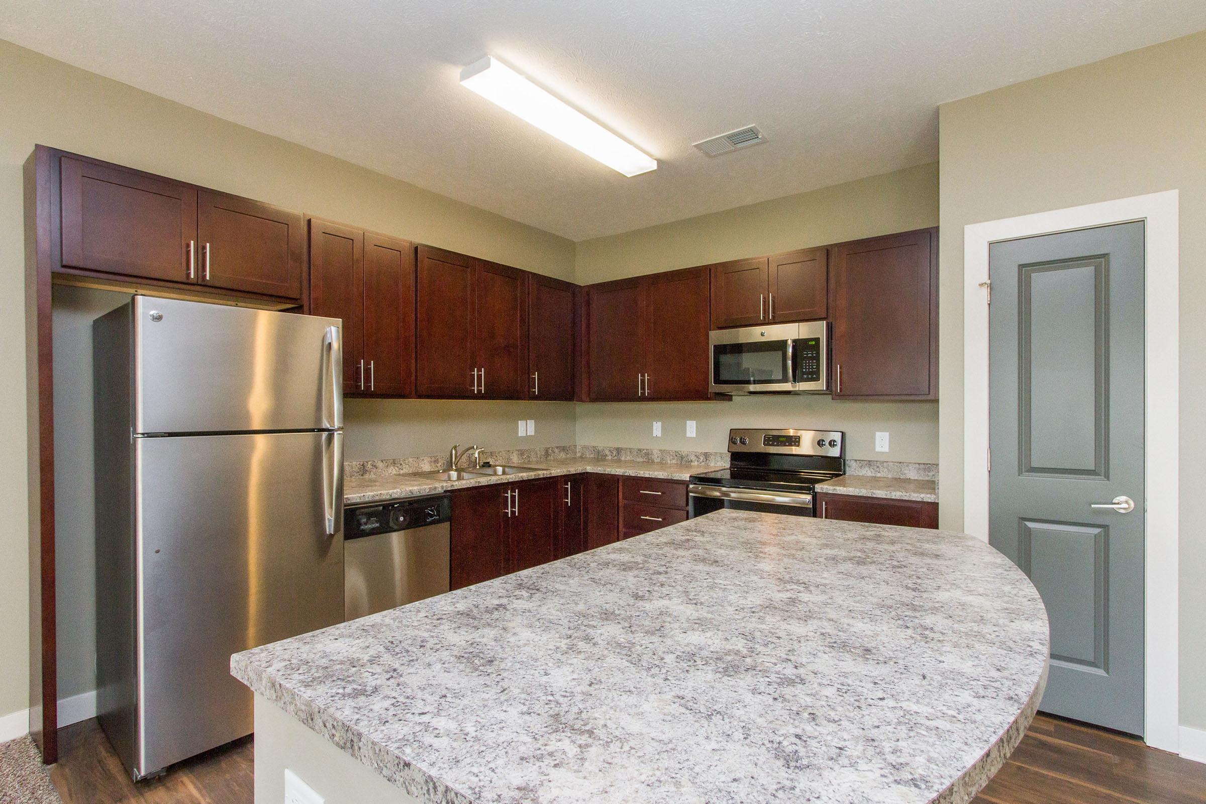 a modern kitchen with stainless steel appliances