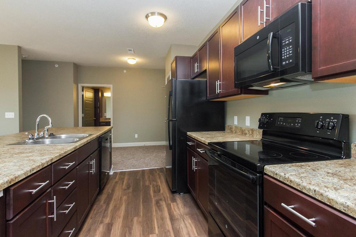 FULLY-EQUIPPED KITCHEN AT THE SUMMIT AT SUNNYBROOK VILLAGE