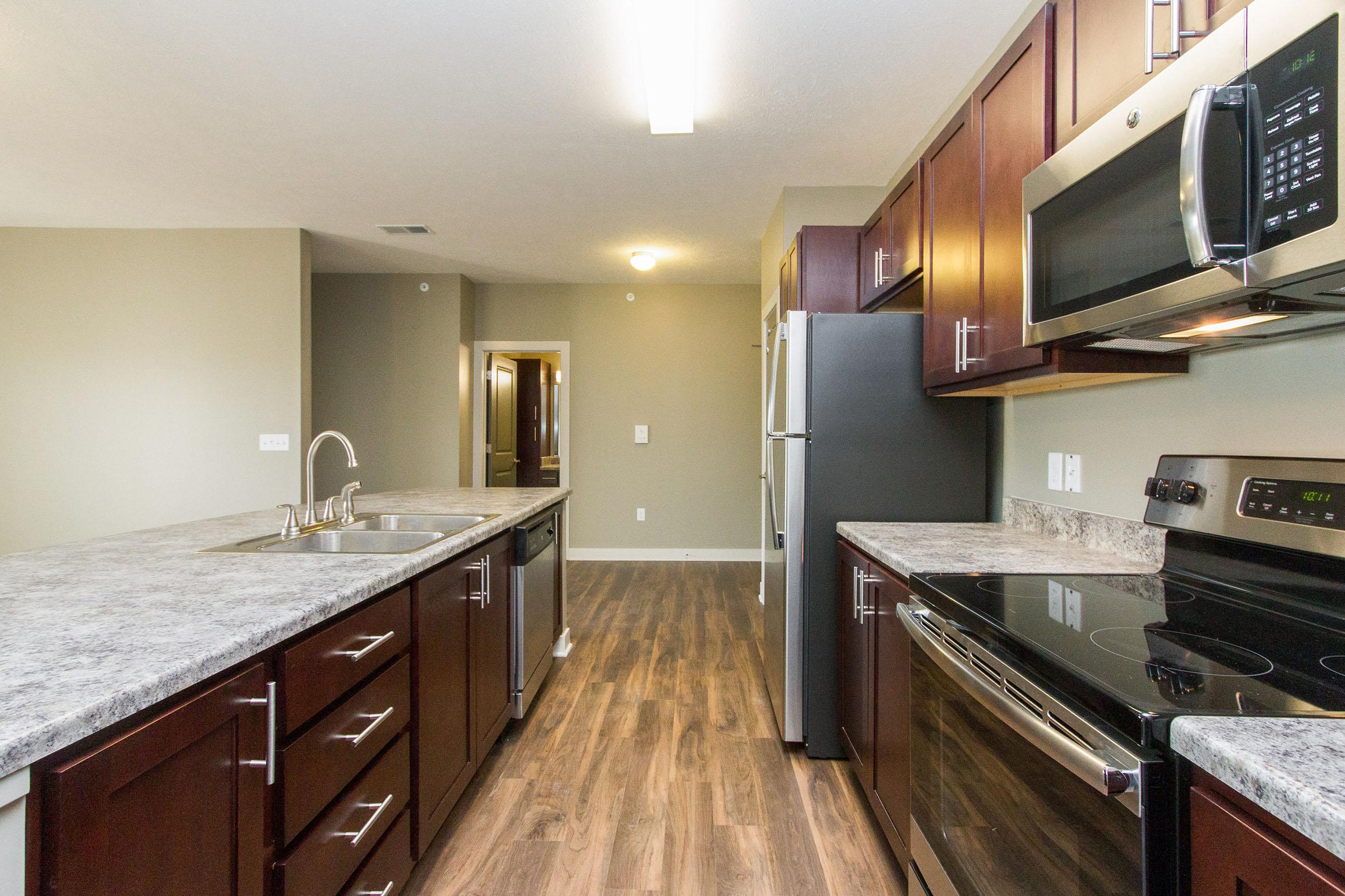 a large kitchen with stainless steel appliances