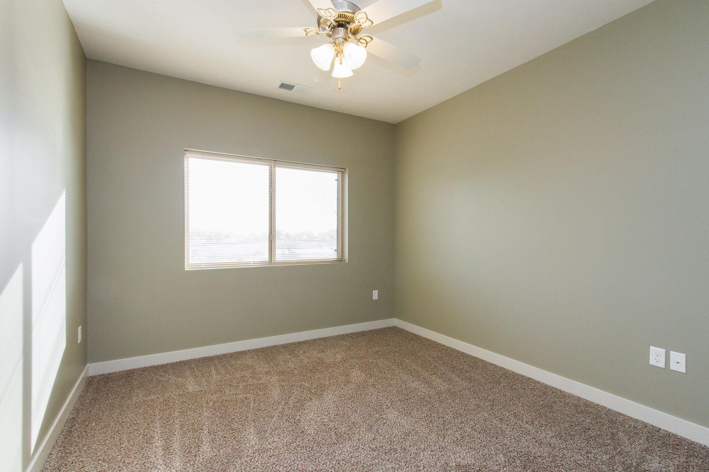 a bedroom with a large mirror