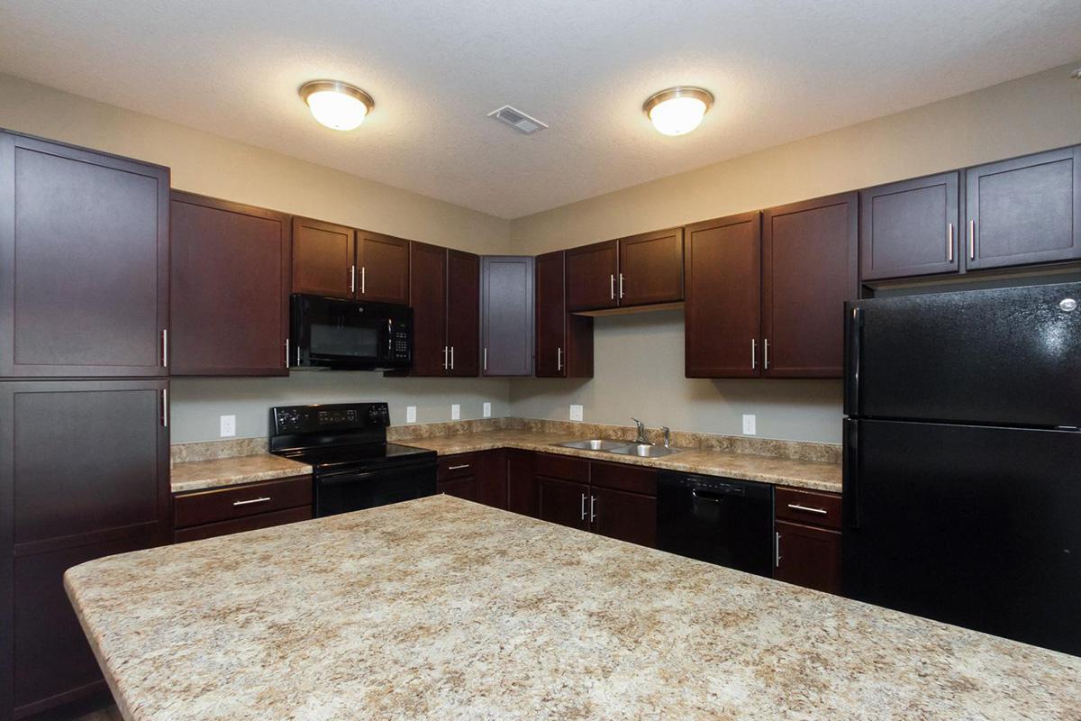 a large kitchen with stainless steel appliances