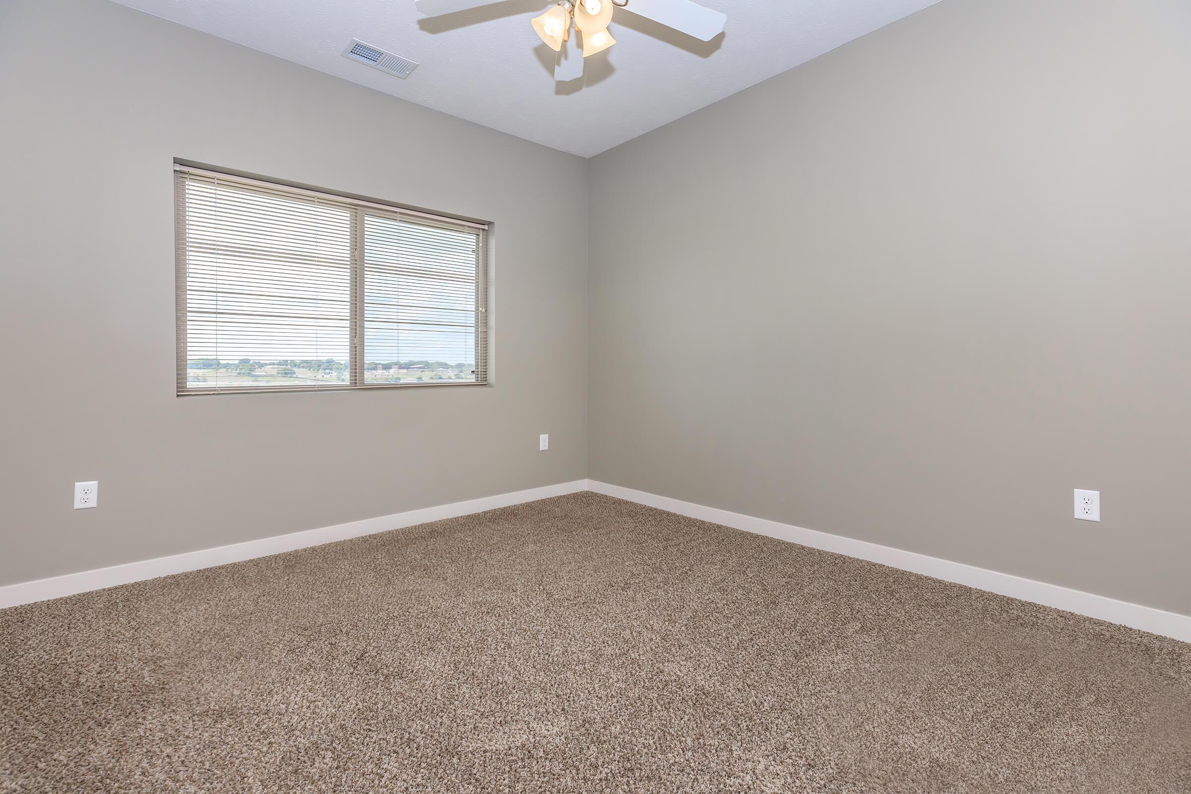 a bedroom with a large window