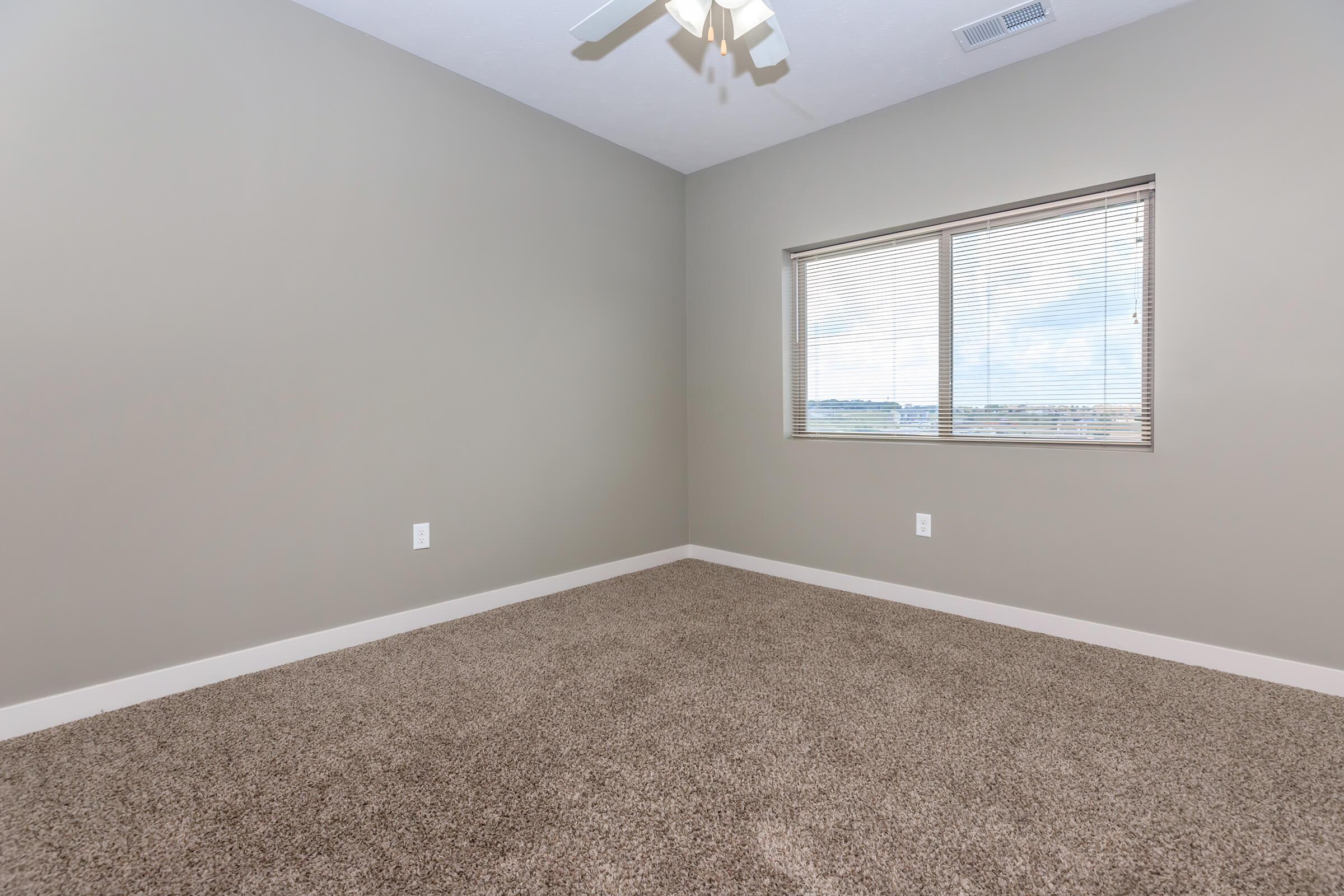 a bedroom with a large window