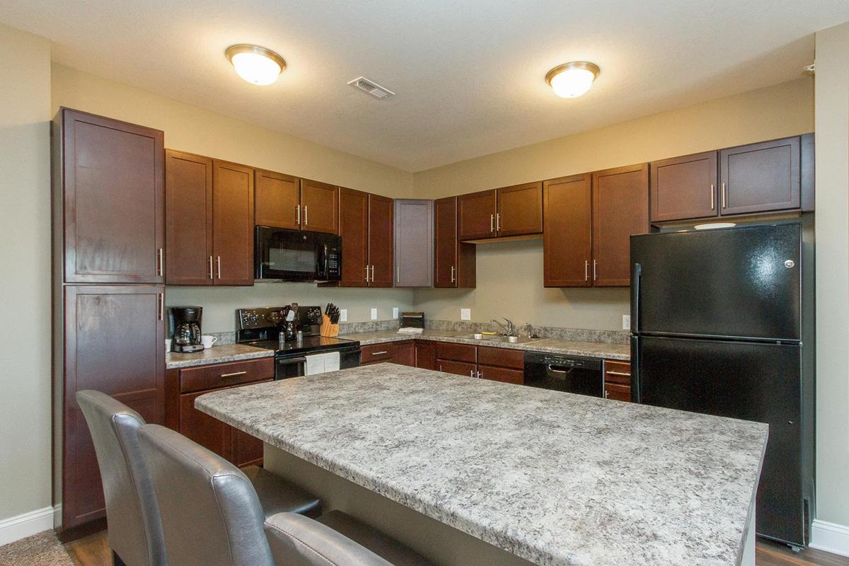 a modern kitchen with stainless steel appliances