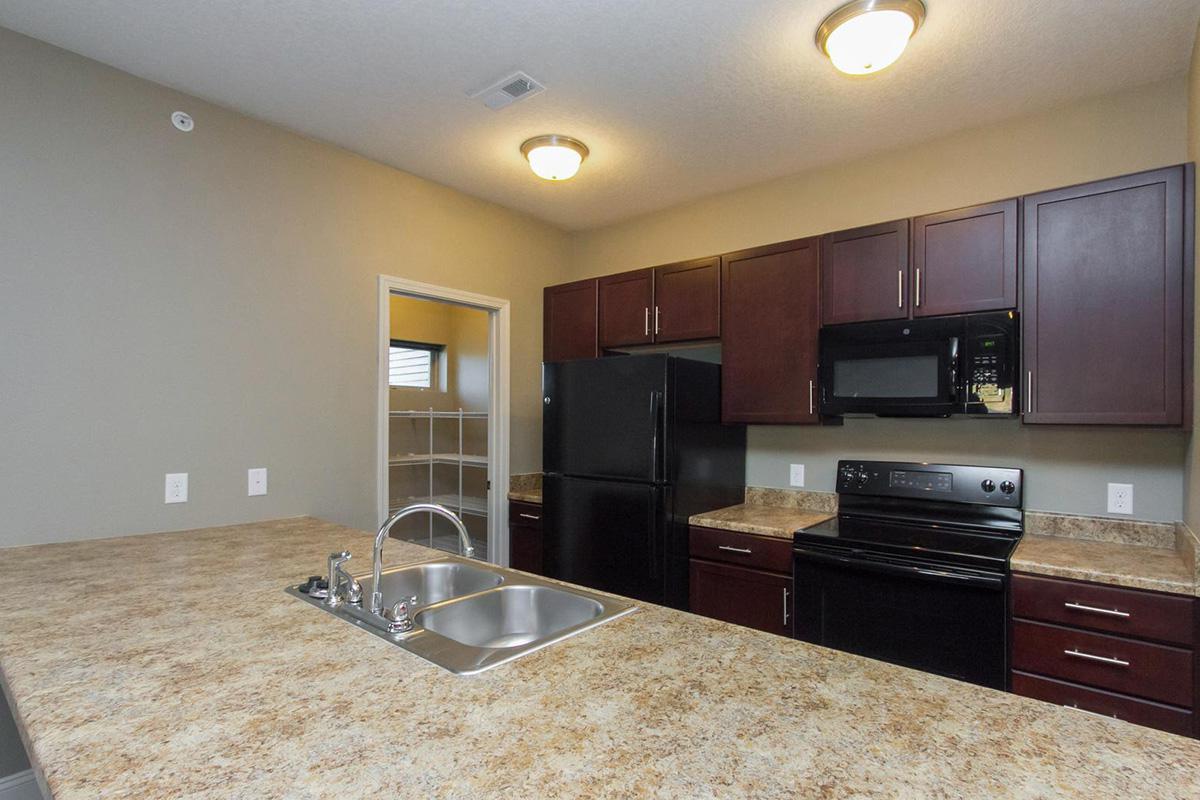 a modern kitchen with stainless steel appliances