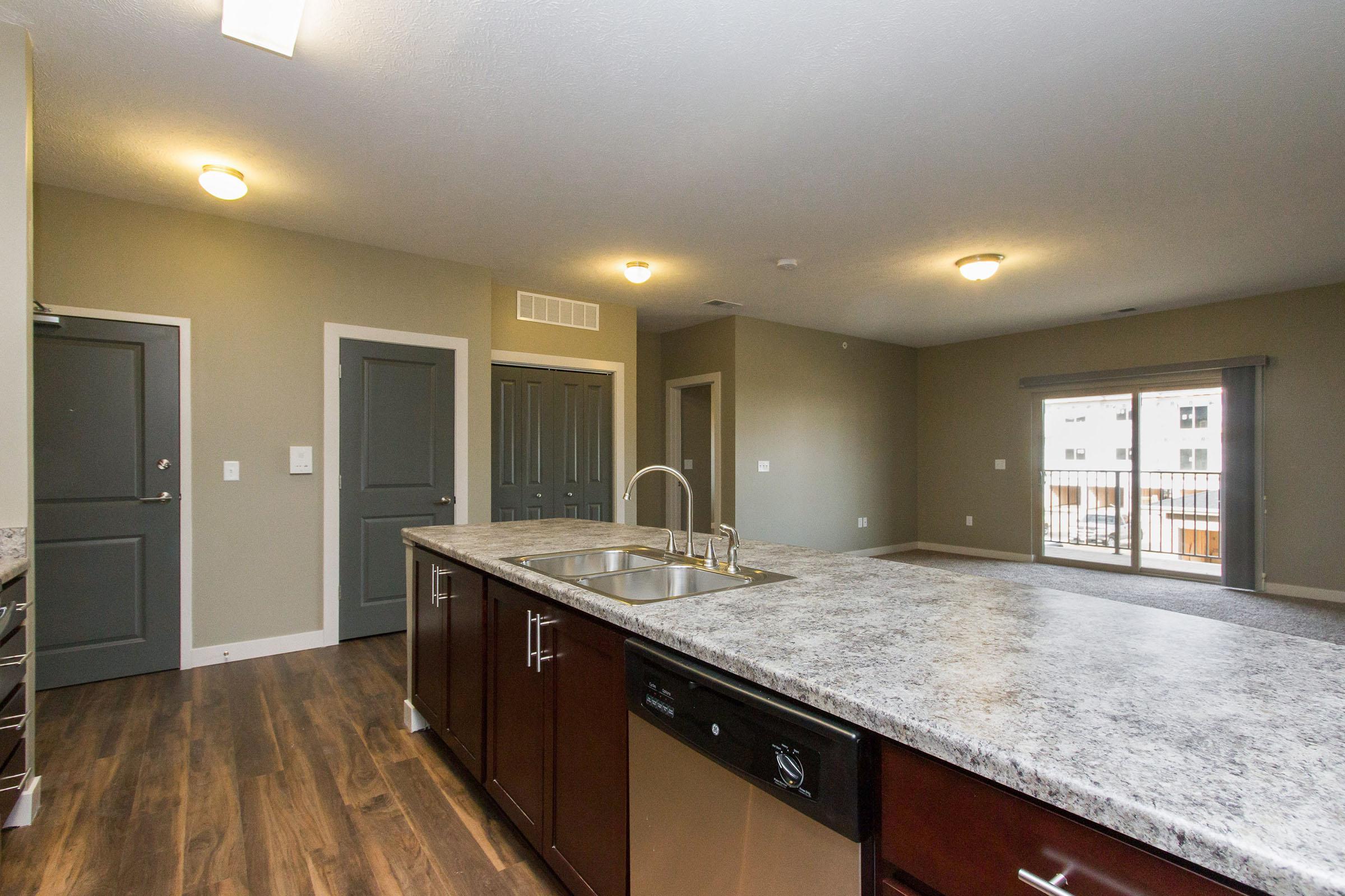 a large kitchen with stainless steel appliances