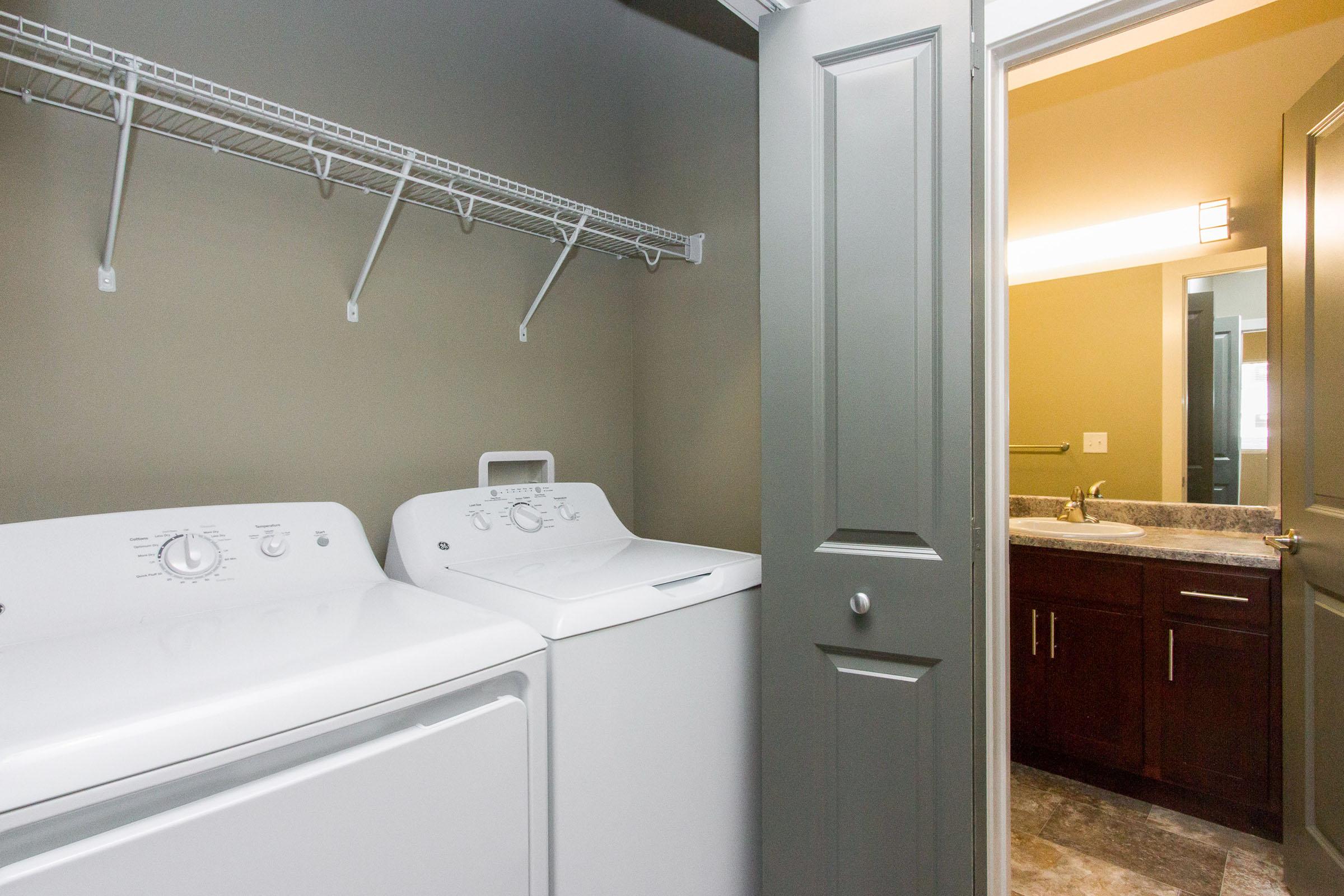 a kitchen with a sink and a mirror