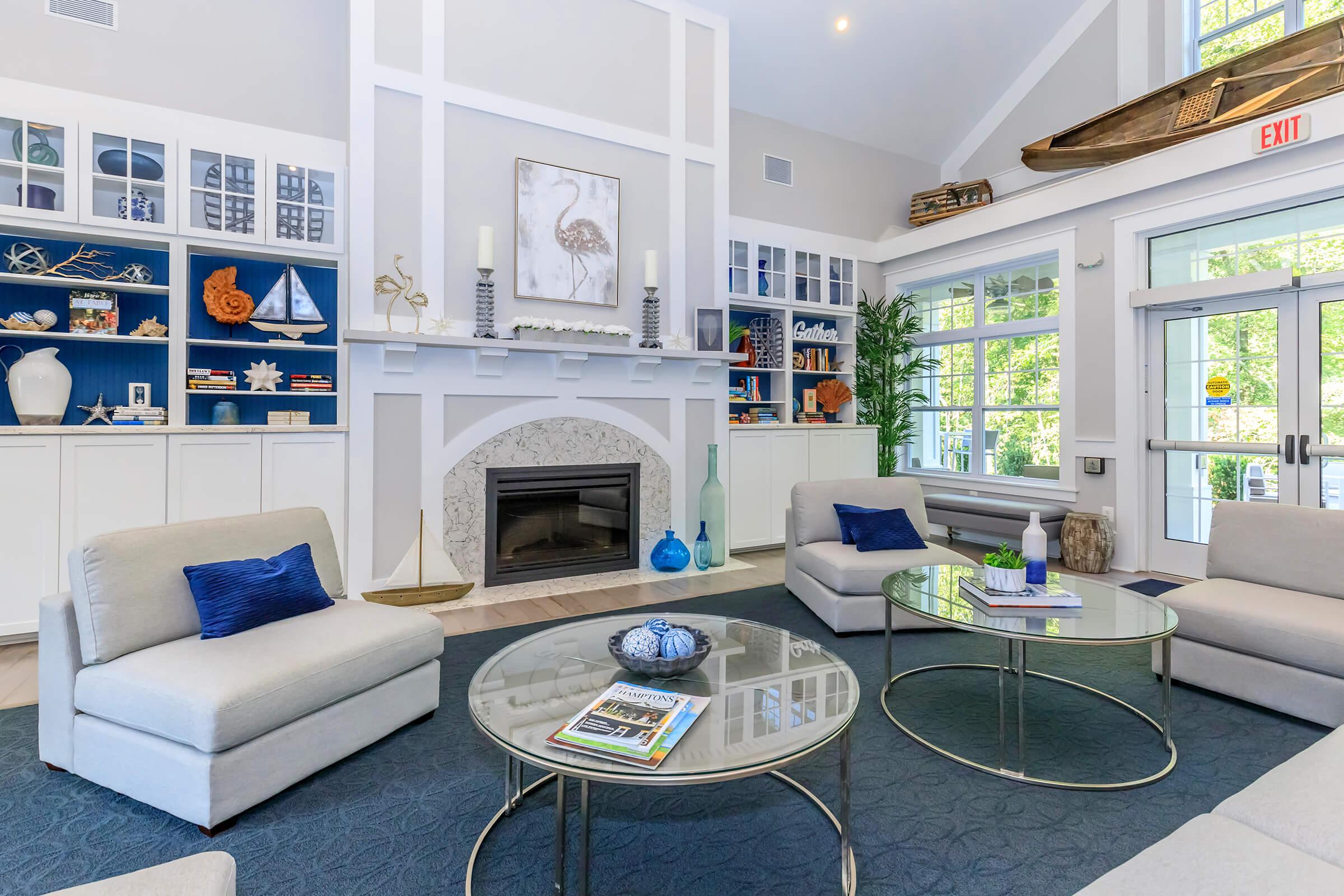 a living room filled with furniture and a large window