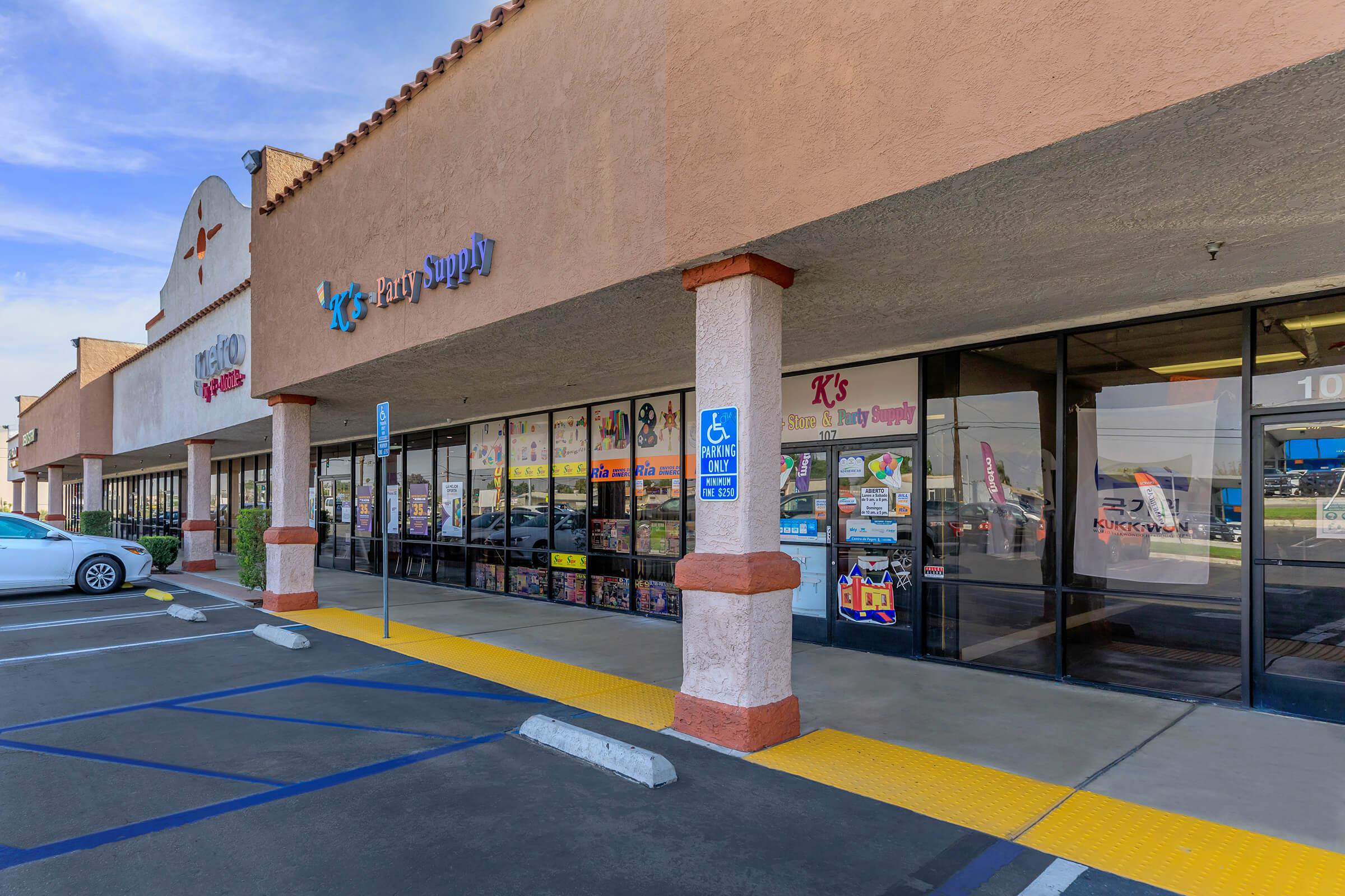 a building with a store on the side of a road