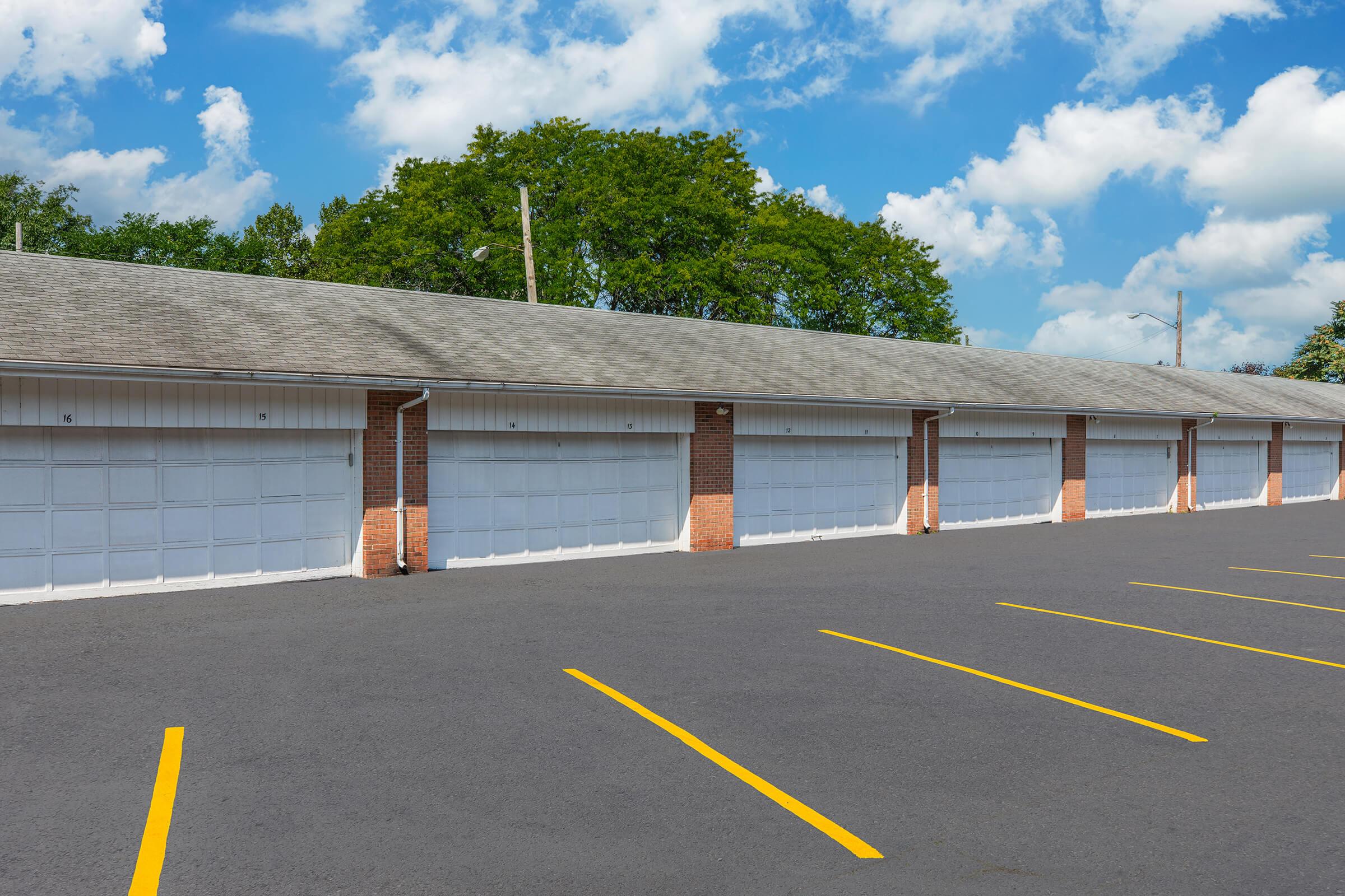 a group of people standing in a parking lot