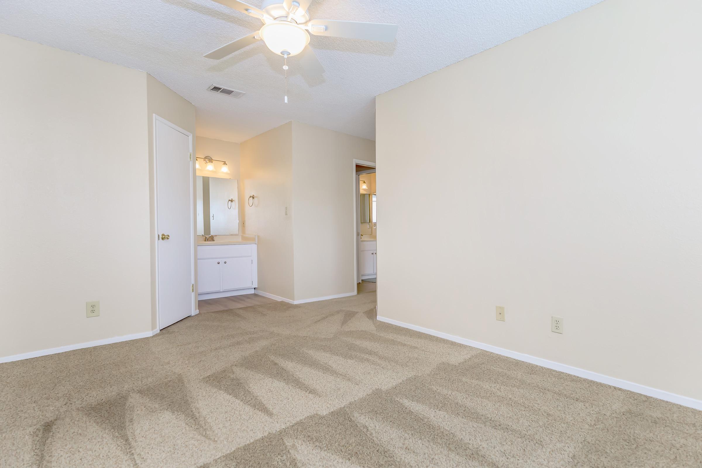 a bedroom with a large mirror