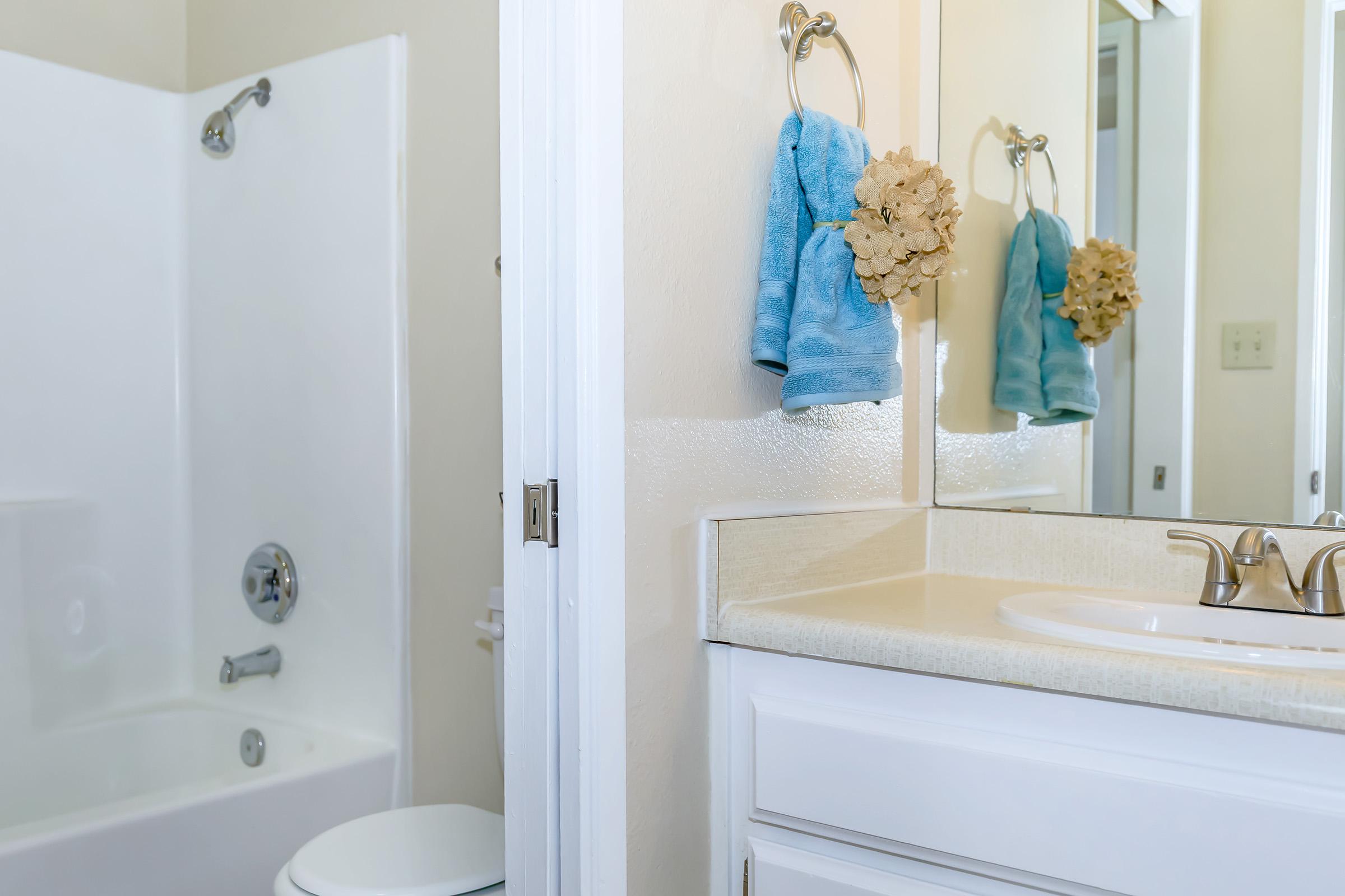 a room with a sink and a mirror