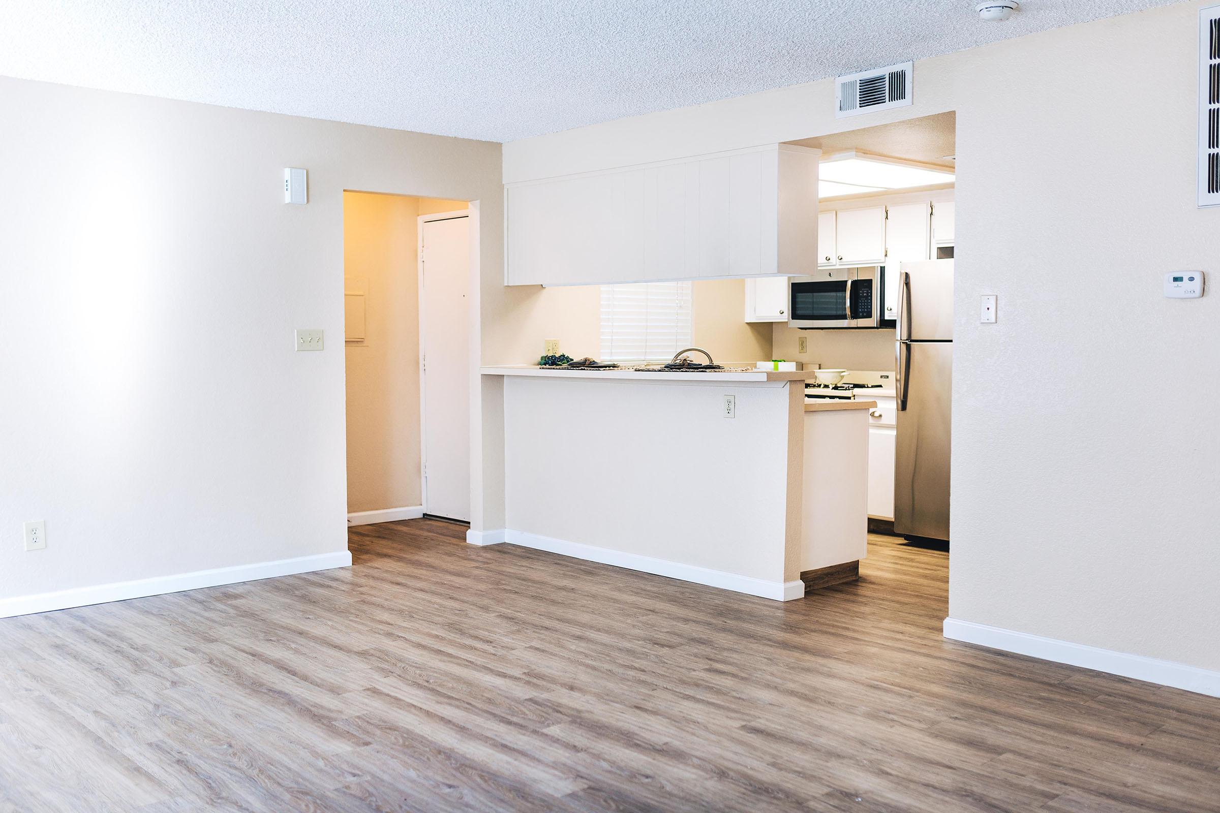 a kitchen with a wood floor