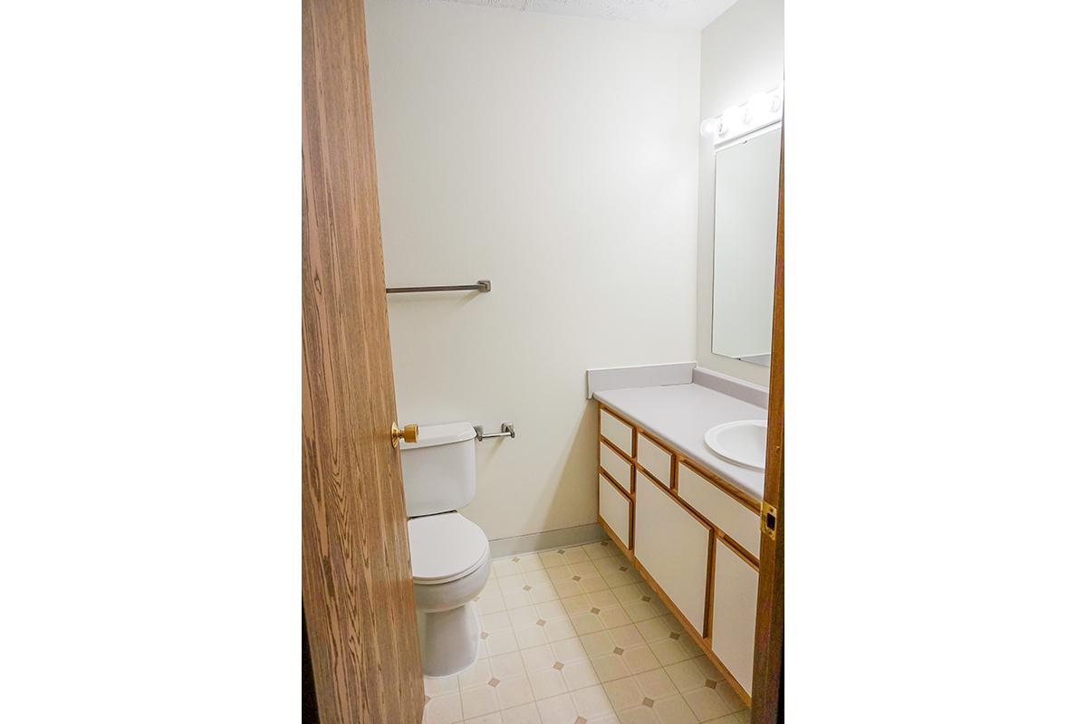 a white sink in a small room