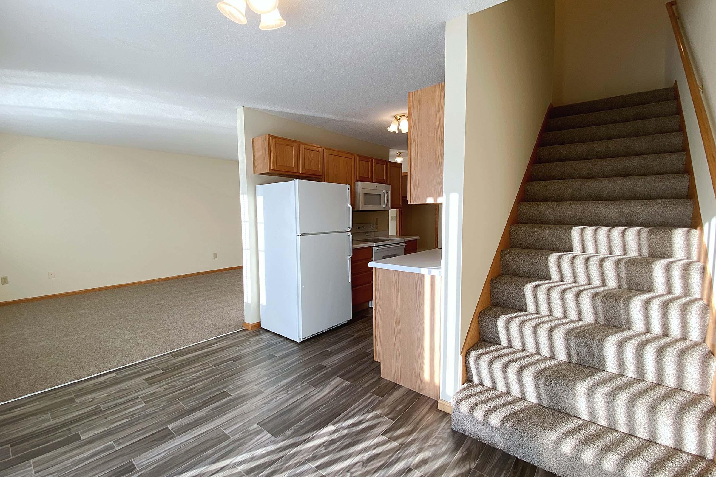 a bedroom with a wooden floor