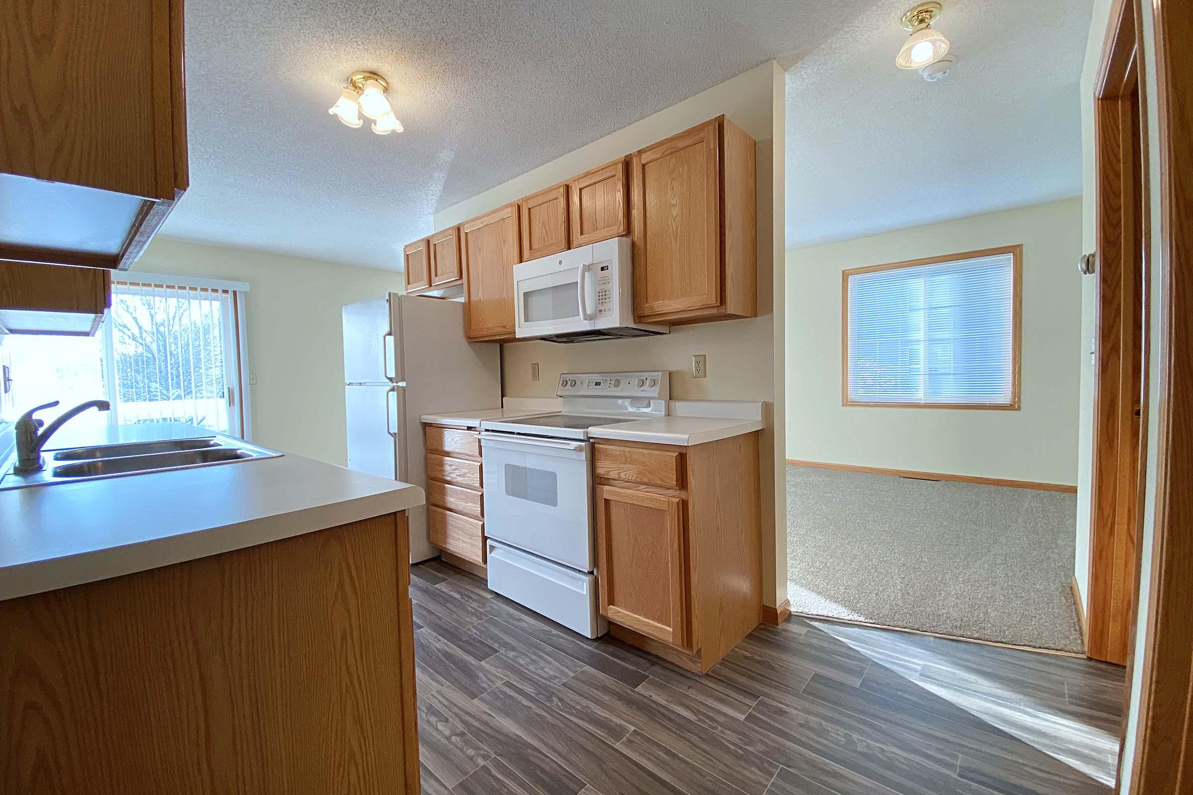 a kitchen with a sink and a window