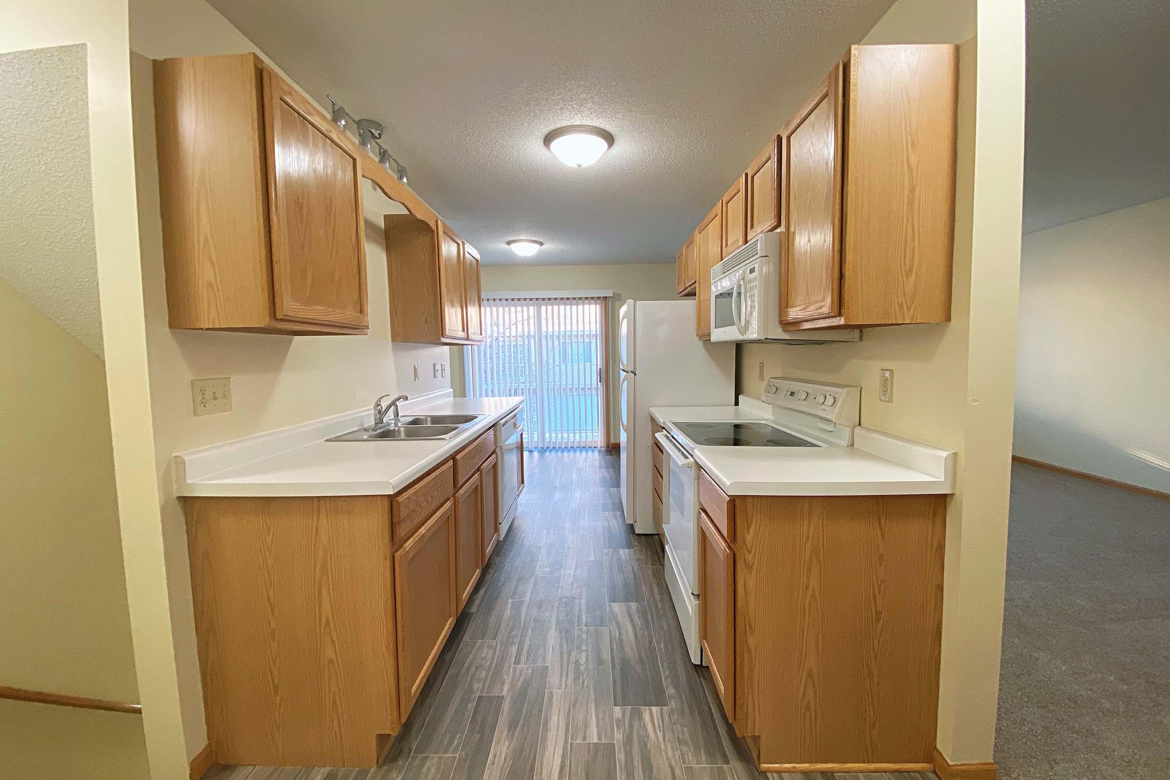 a kitchen with a wood floor