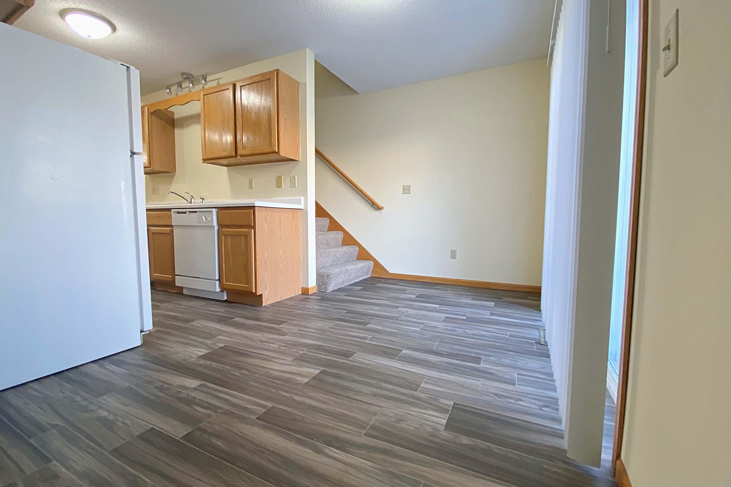 a kitchen with a wood floor